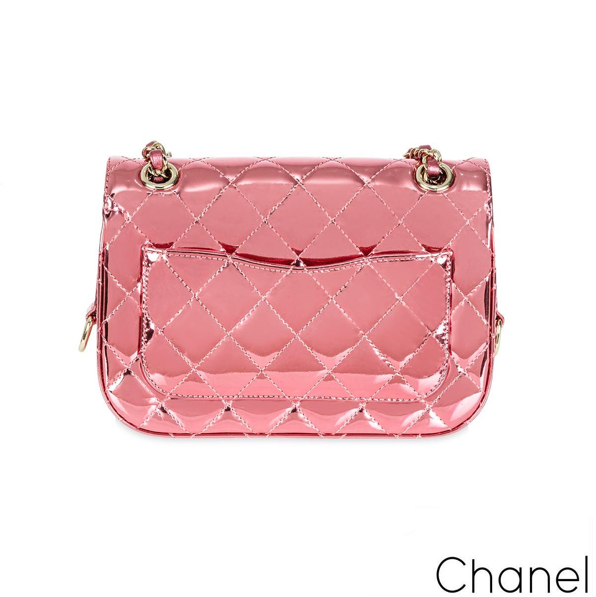 This Chanel Mini Flap Bag is a standout piece from the 24C collection, crafted in Pink Mirror Calfskin and Metallic Calfskin. The bag features diamond quilting, light gold-tone hardware, and a classic CC turn-lock closure. Its chain strap,