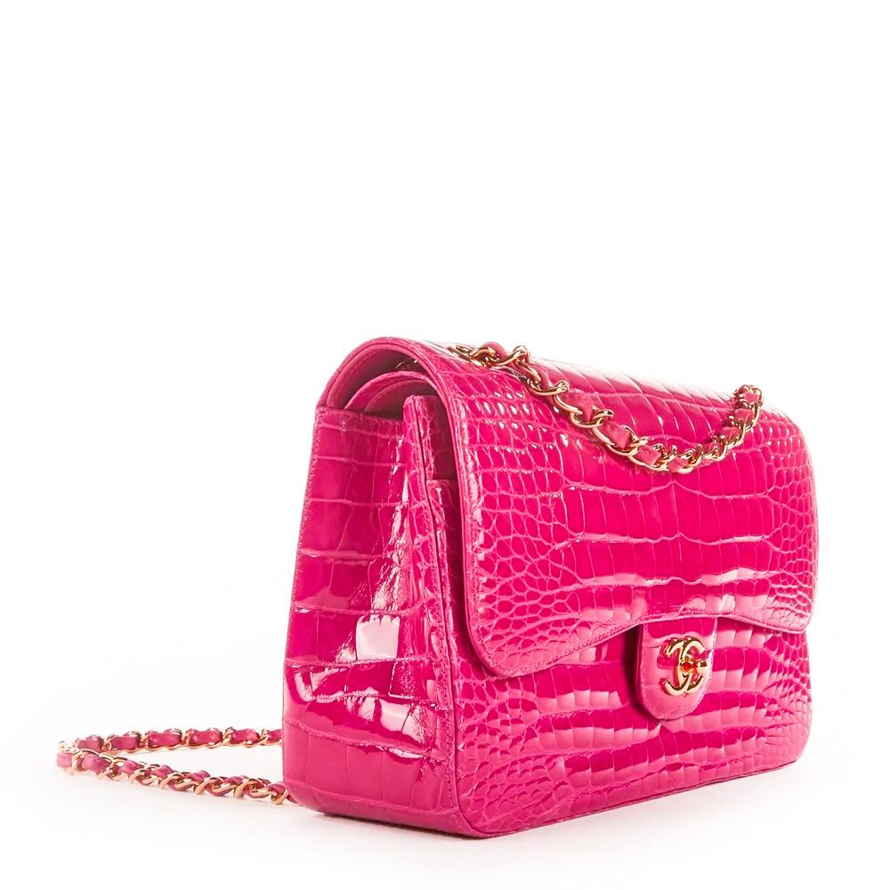 Rare Hot Pink CHANEL Alligator Jumbo Double Flap Bag is a must for any collector of exotic handbags in general and Chanel bags in particular!  Features hot pink shiny alligator leather with gold-tone hardware, CC turn-lock closure, convertible