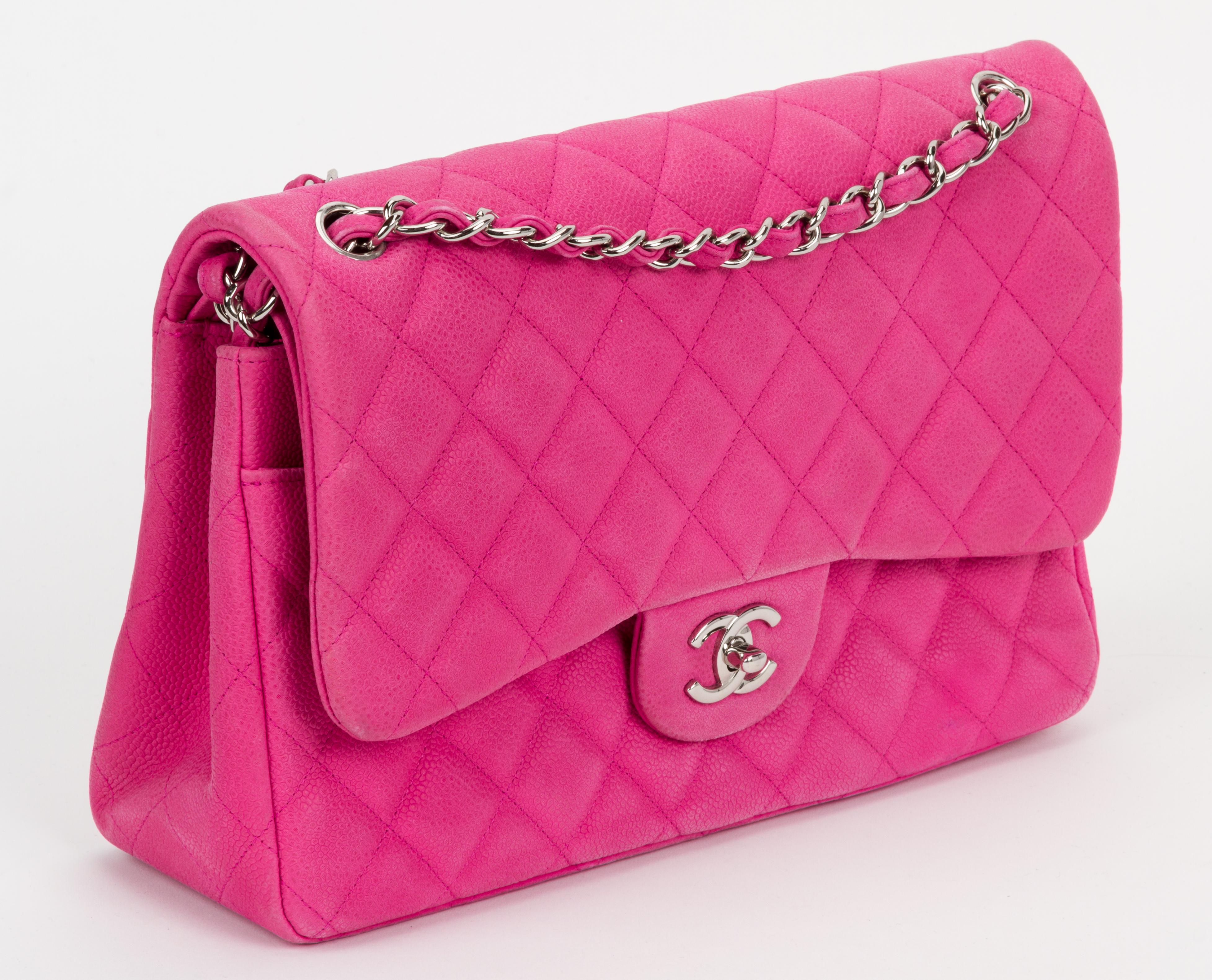 Chanel jumbo classic double flap. Hot pink caviar leather quilted with silver tone metal hardware. Single drop 24