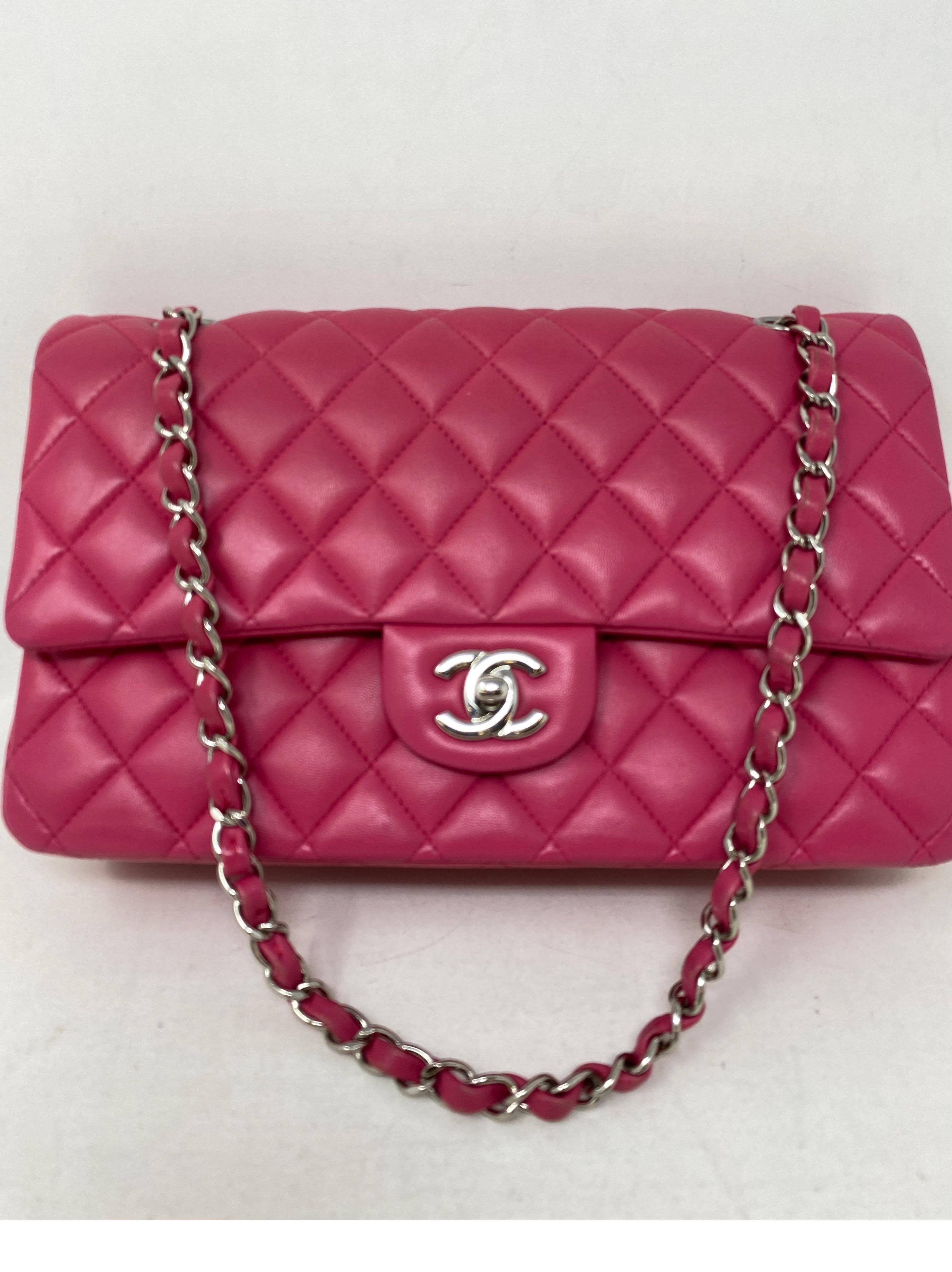 Chanel Hot Pink Medium Double Flap Bag. Lambskin hot pink color. Beautiful leather bag in good condition. Rare sought after hot color. Silver hardware. Includes dust cover and box. Guaranteed authentic. 