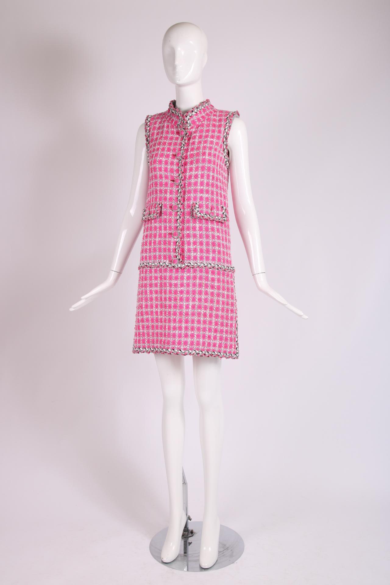 Chanel ca. 2014 shocking pink sleeveless tweed mini dress with fabric-covered frontal buttons closures, two frontal pockets, side zippers at skirt hem, hidden side pockets and trim made of multicolored and metallic silver 