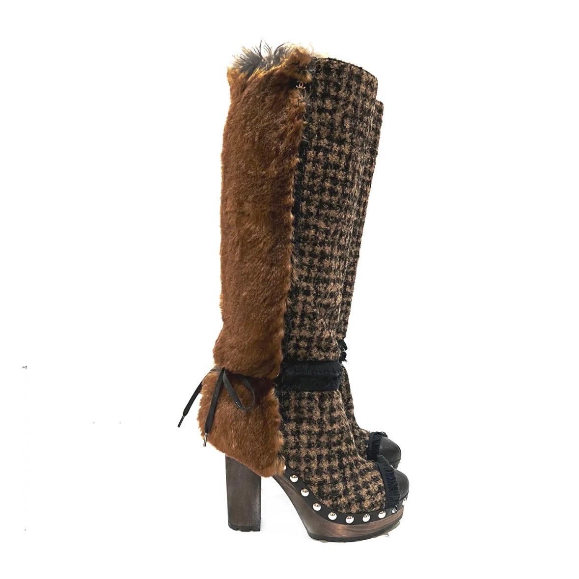 Houndstooth Fur Heel Boot by Chanel
Fall / Winter 2010 
Made in Italy 
Brown
Houndstooth tweed detail on front of boot
Rabbit fur on back of boot detail
Fringe detail near ankle and toe
Silver stud trim detail around foot
Dark wood platform and