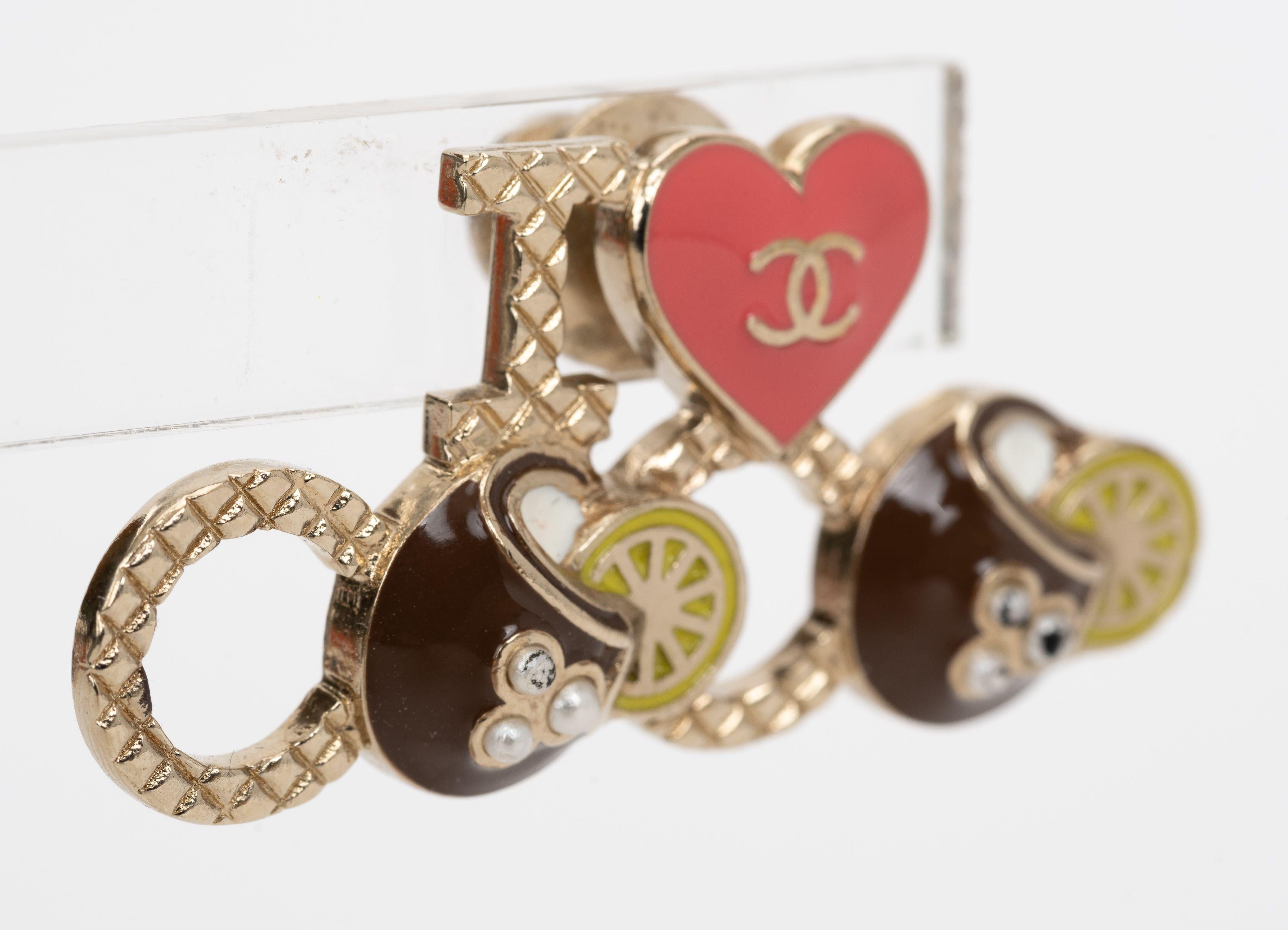 Chanel I Love Coco Brooch features textured lettering that says I Love Coco, with heart and limes. From Cruise 2017 collection. Comes with velvet pouch.