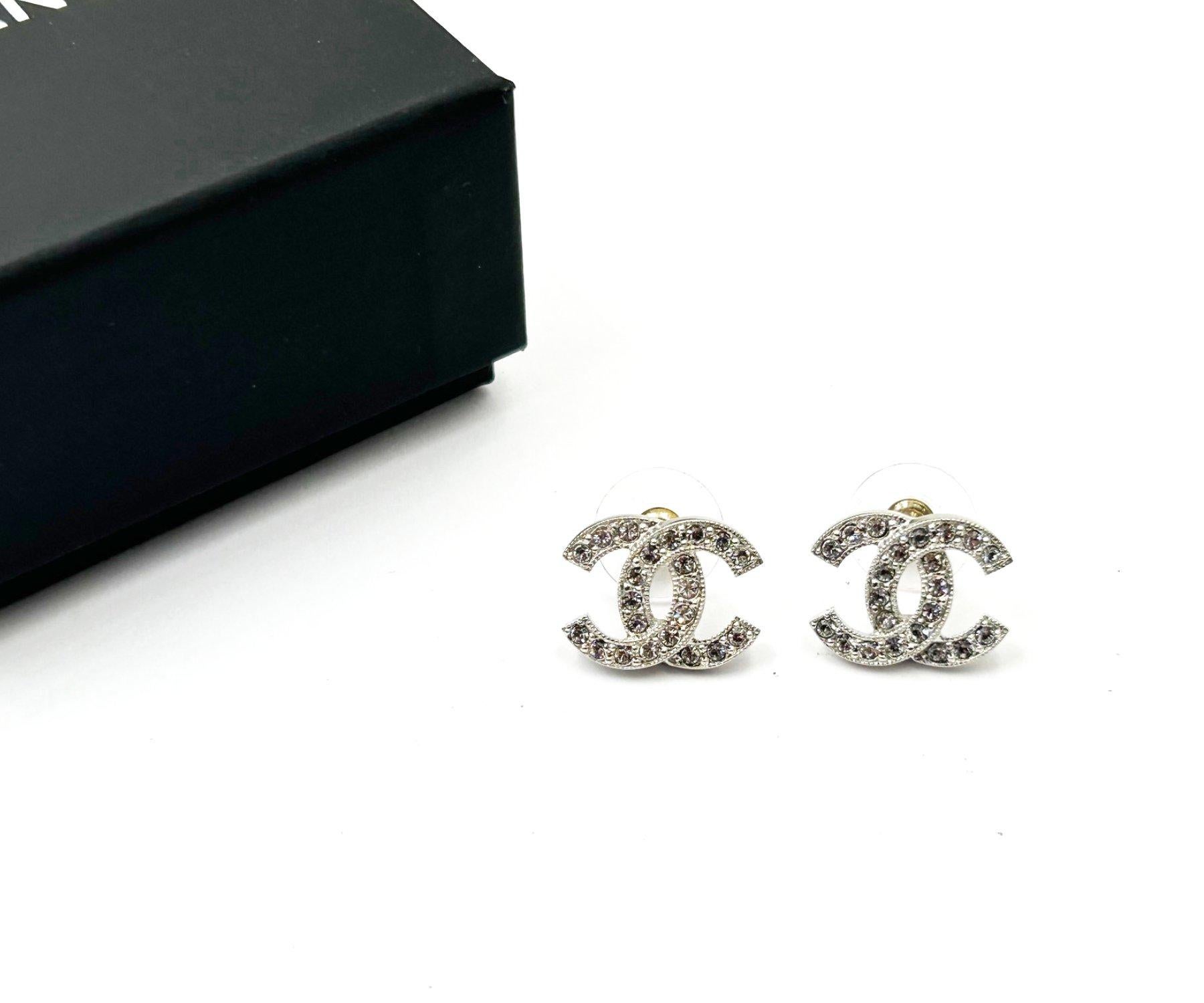 Artisan Chanel Iconic Classic Silver CC Crystal Reissued Stud Medium Piercing Earrings   For Sale