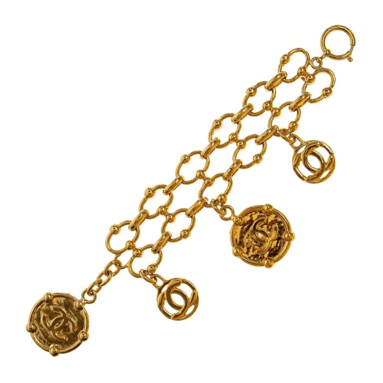 Chanel iconic gold tone cc logo charms bracelet