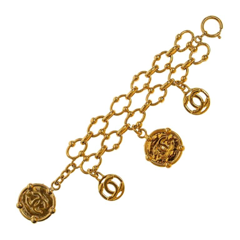 Chanel iconic gold tone cc logo charms bracelet For Sale at 1stDibs