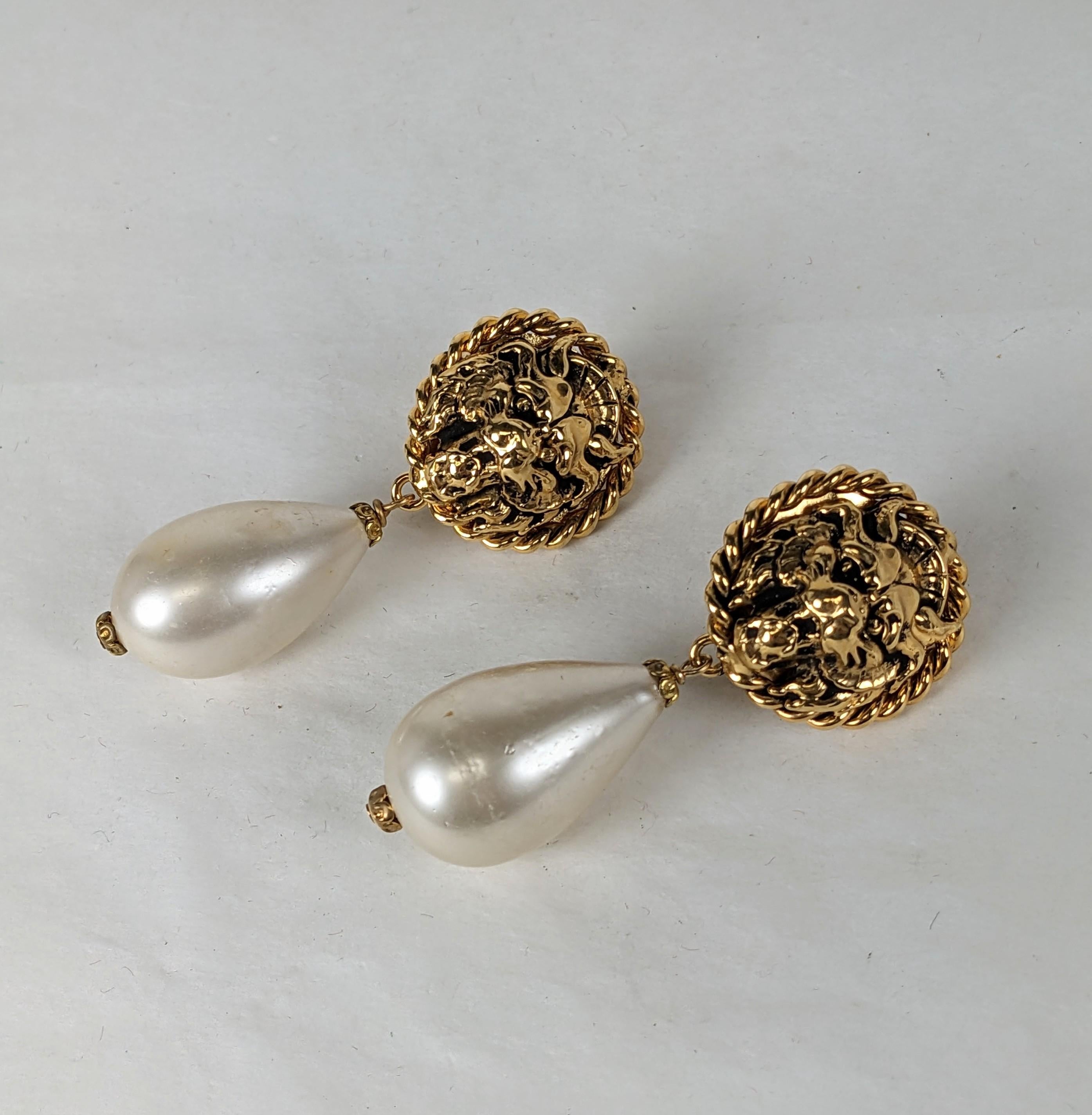 Chanel Iconic Lion and Pearl Drop Earrings from the 1980's. Gilt lion head motif on clip earrings with Gripoix faux pearl glass drops. Unsigned, 1980's France.
2.25