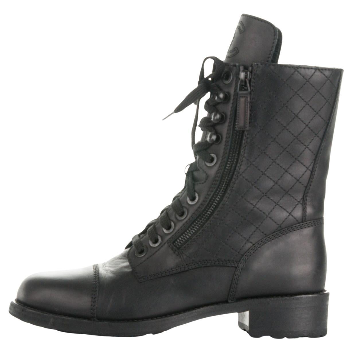 Chanel Iconic Logo Classic Calfskin Leather Diamond Stitch Combat Boots 

Size 41

Calfskin leather 
Rubber base sole
Full length laces 
CC stitched logo at the top of tonge
Quilted side panels and zippers along sides
Made in Italy

As seen on Irina