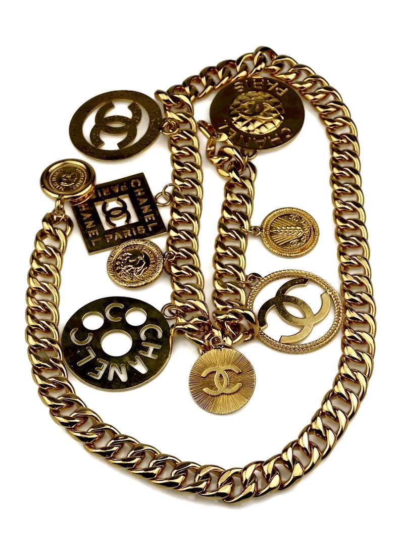 Features:
- 100% Authentic CHANEL from 1992 collection.
- Chunky chain and jumbo charms in gold tone.
- Compose of 9 massive Chanel logo charms - Cut Out CC logos, Coco Mademoiselle, elephant and wheat .
- Signed CHANEL 2 CC 8 Made in France.
- Hook