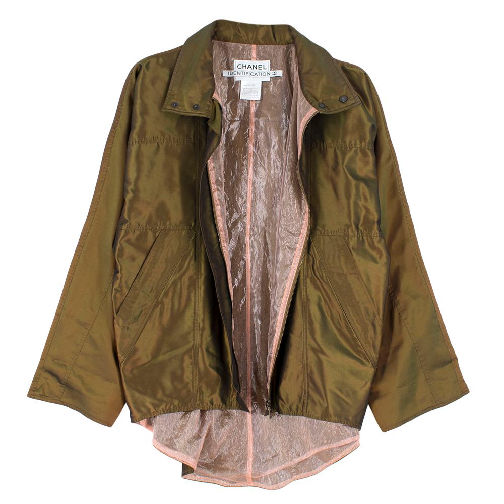 Chanel Identification - Brown Iridescent Silk Jacket 

- concealed zip fastening
- snap buttons at the collar
- long sleeve
-  curved asymmetrical hem 
- fully lined 
- pockets at the side with zip closure
- oversized 

- 100% Silk, Lining 68%