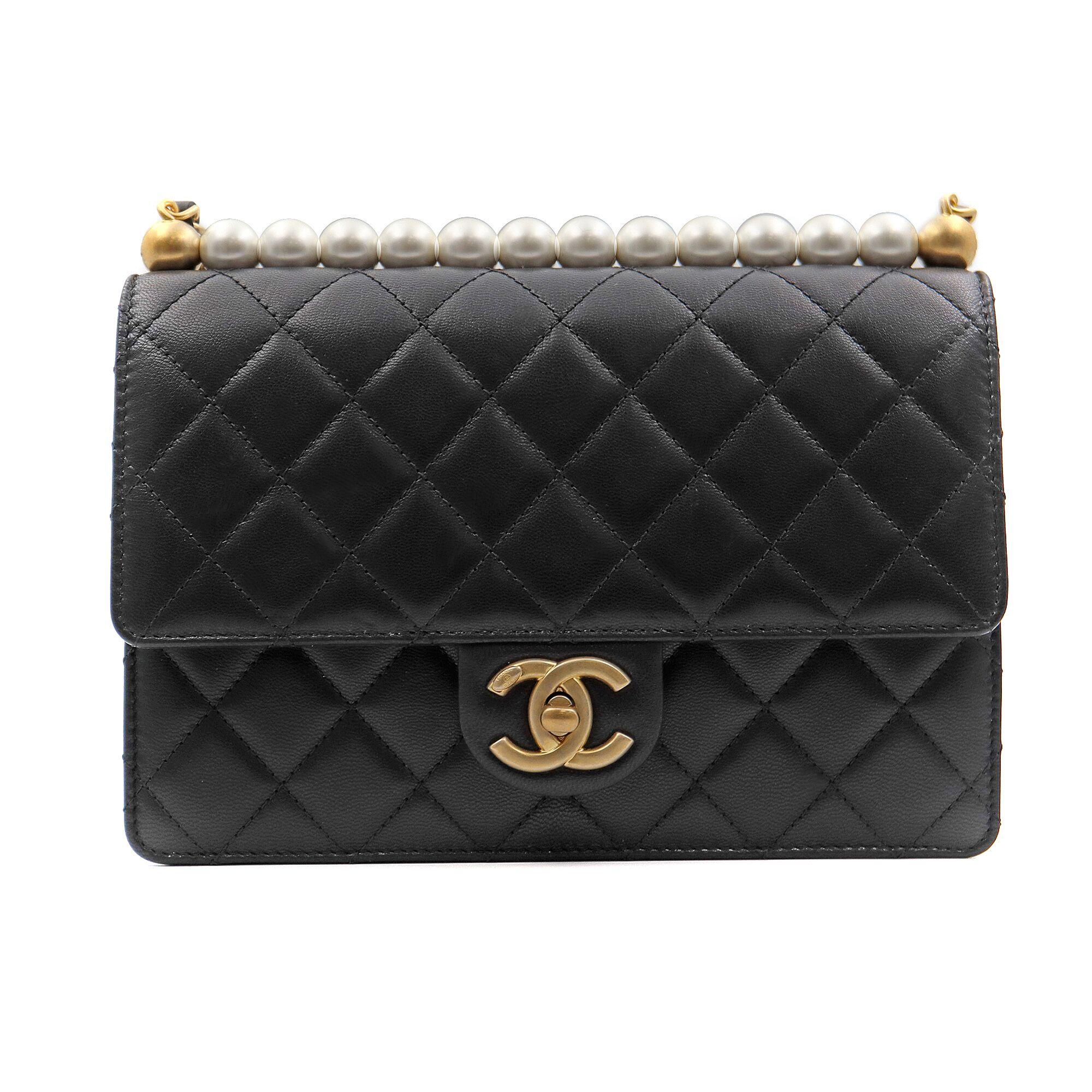 Chanel black goatskin, Imitation Pearls & Gold-Tone Metal flap bag. Cross-body style. Very classic, elegant an chic. 
New without tags, no signs of wear. Comes with original box, papers and a dust bag.
Measurements: L: 8.5 inch, H: 6.5 inch, D: 2