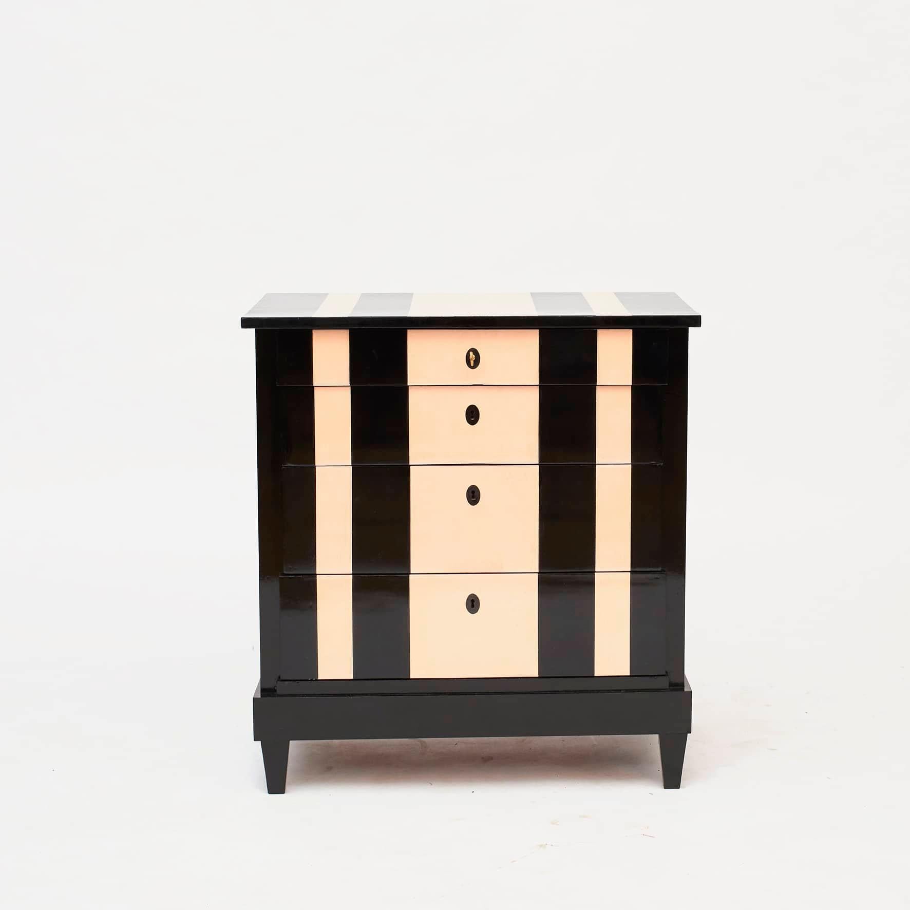 'Chanel' inspired chest of drawers. Danish chest of drawers, late empire, circa 1840.
Mahogany with later finish of ebonized (black) and rosa polish in stripes with French polish, which gives the chest of drawers a beautiful and elegant look.