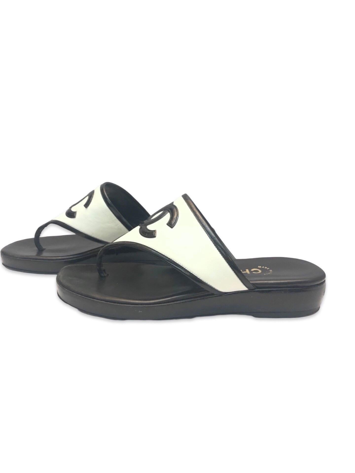 - Vintage 90’s classic Chanel black and white sandals. Featuring a patent interlocking CC, contrasting with white leather. You can never go wrong with Chanel, plus the black and white design. 

- Size 37.5  