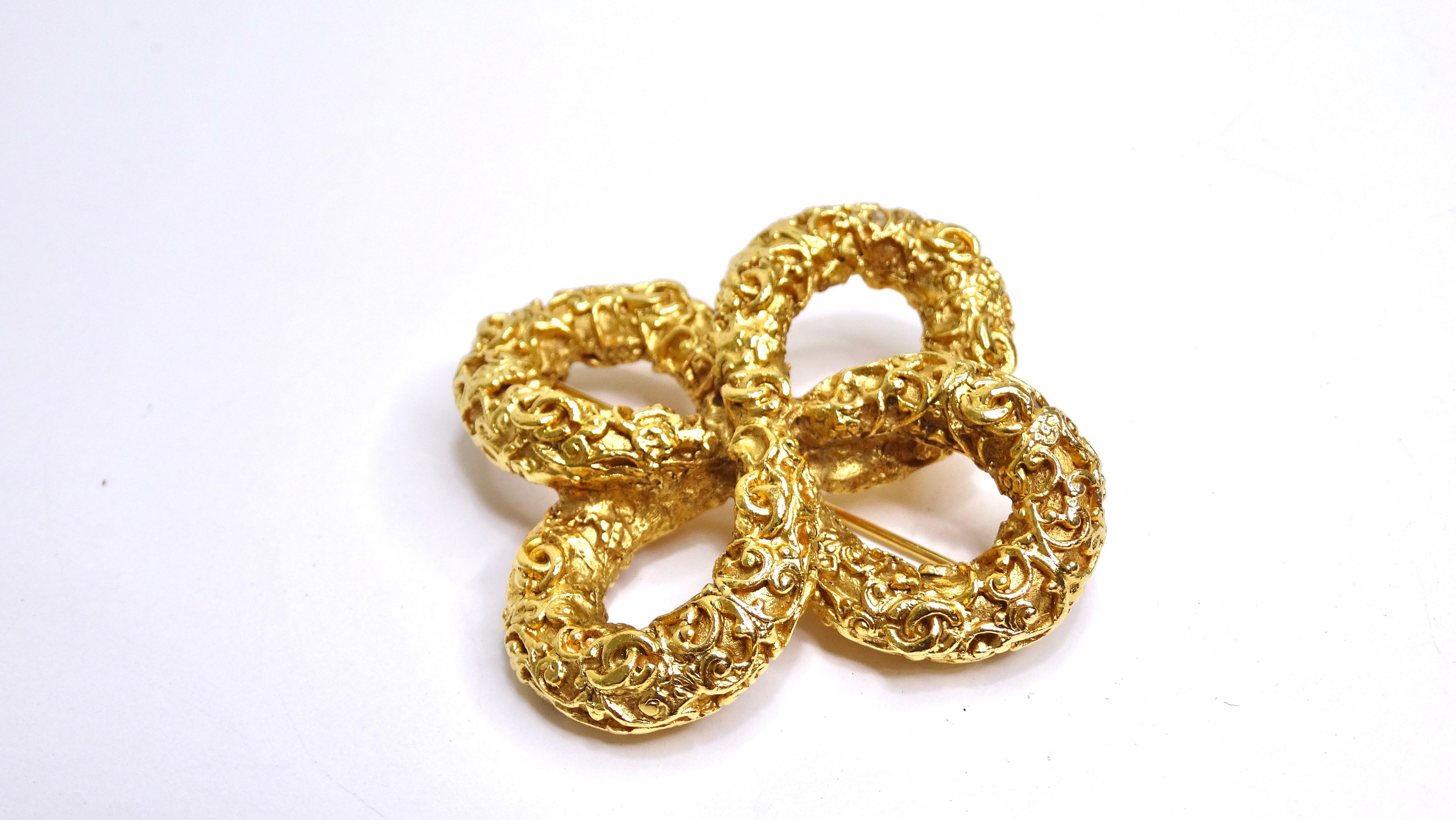 If you ever get tired of loud branding but love with the quality and glamour of the house of Chanel, this is the perfect brooch for you. This brooch is made of highly textured and rich bright gold. Do not miss the subtle details like the tiny 'cc'