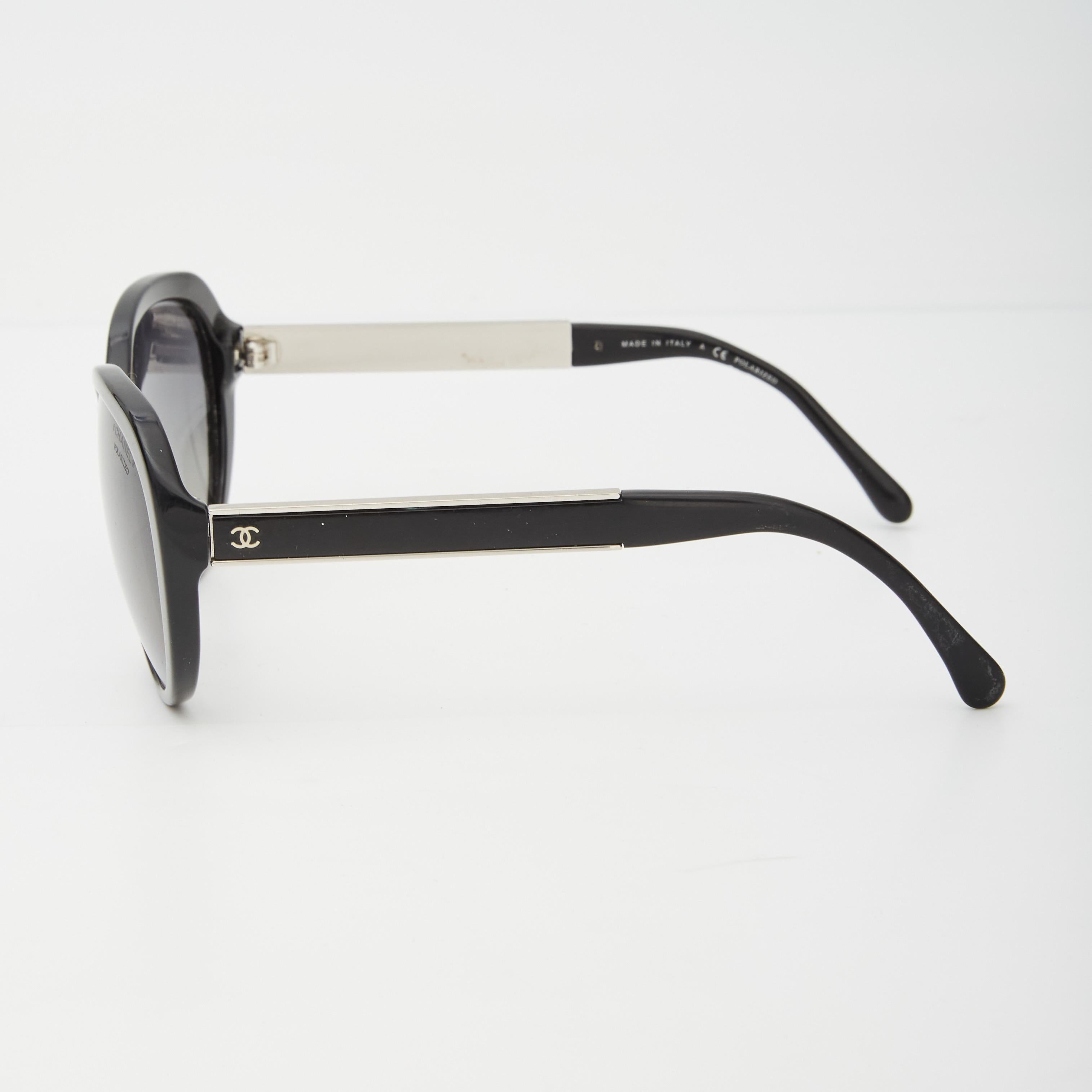 The Chanel sunglasses by Karl Lagerfeld are made of black Acetate and feature a car-eye shape, an interlocking CC logo on the side and tinted lenses.

COLOR: Black
CODE: 5269 c.501/S8
SIZE STAMP: 56 ☐ 17  135
FRAME MATERIAL: Acetate

MEASURES~
Arms: