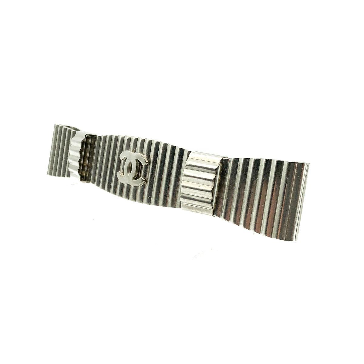 The forever iconic Chanel CC Barrette Hairslide. Crafted in silver-tone metal. Featuring an elongated bow style set with the interlocking CC logo. In very good condition, signed, approx. 11cms. An iconic piece from the House that will add the