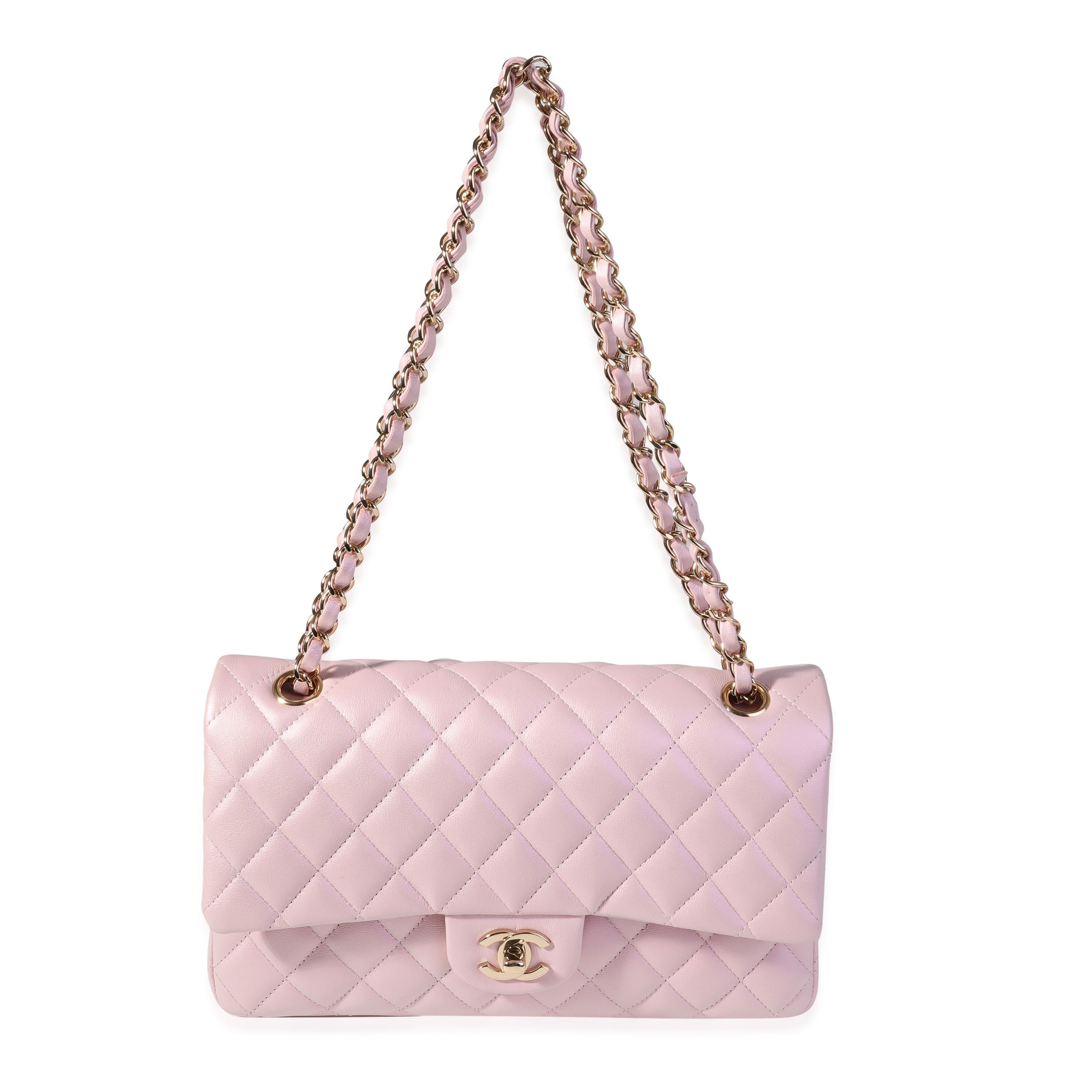 Listing Title: Chanel Iridescent Pink Quilted Calfskin Medium Classic Double Flap Bag
SKU: 119940
Condition: Pre-owned 
Handbag Condition: Excellent
Condition Comments: Excellent Condition. Plastic on some hardware. Hairline scratching to hardware.