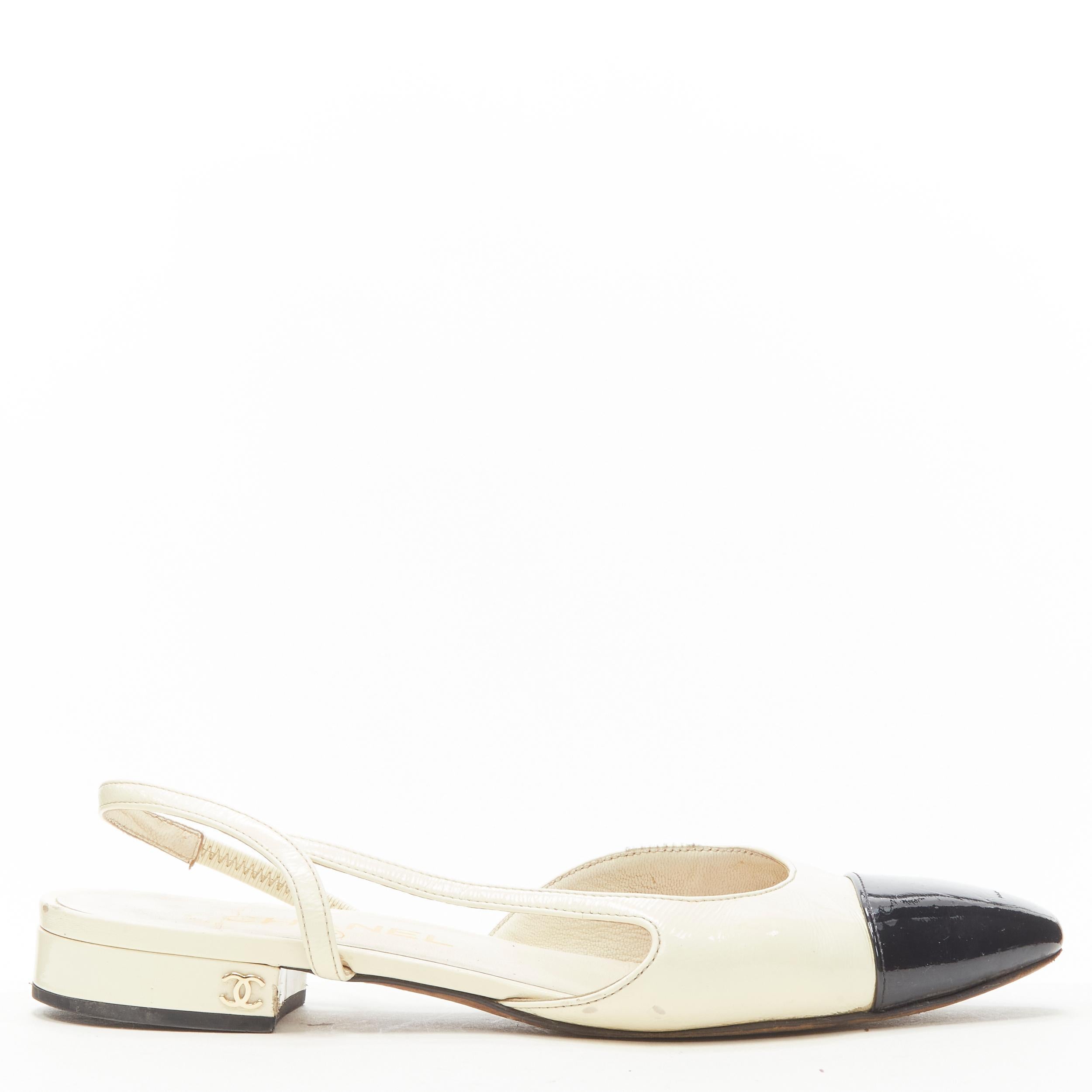 CHANEL ivory black toe cap patent leather sling back CC heel flats EU36 
Reference: JACG/A00068 
Brand: Chanel Designer: L 
Material: Patent Leather 
Color: Beige 
Pattern: Solid 
Closure: Slingback 
Extra Detail: CC logo at heel. 
Made in: Italy