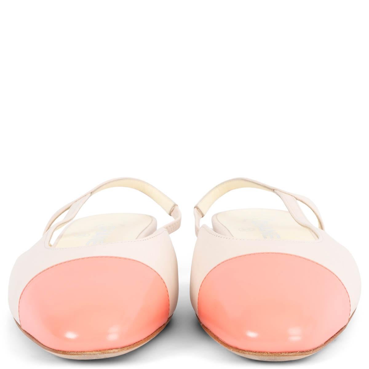 100% authentic Chanel slingback flats in off-white lambskin featuring classic cap toe in coral leather. CC in silver-tone hardware on the heel. Have been worn once or twice and show two very soft scratches on the right shoe. Overall in excellent