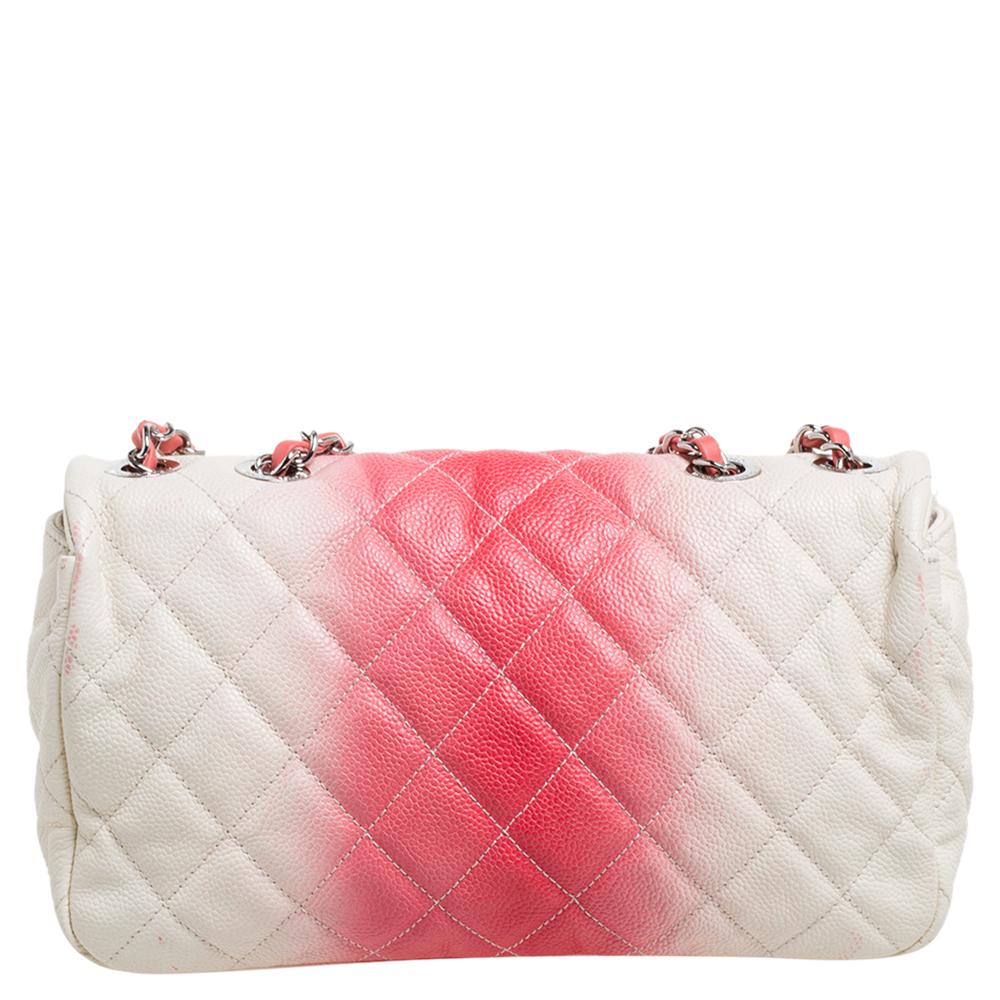 We are loving this flap bag from Chanel as it is appealing in a luxurious way. Exquisitely crafted from Caviar leather in their quilt design, it bears their signature label on the canvas interior and the iconic CC turn-lock on the flap. The piece