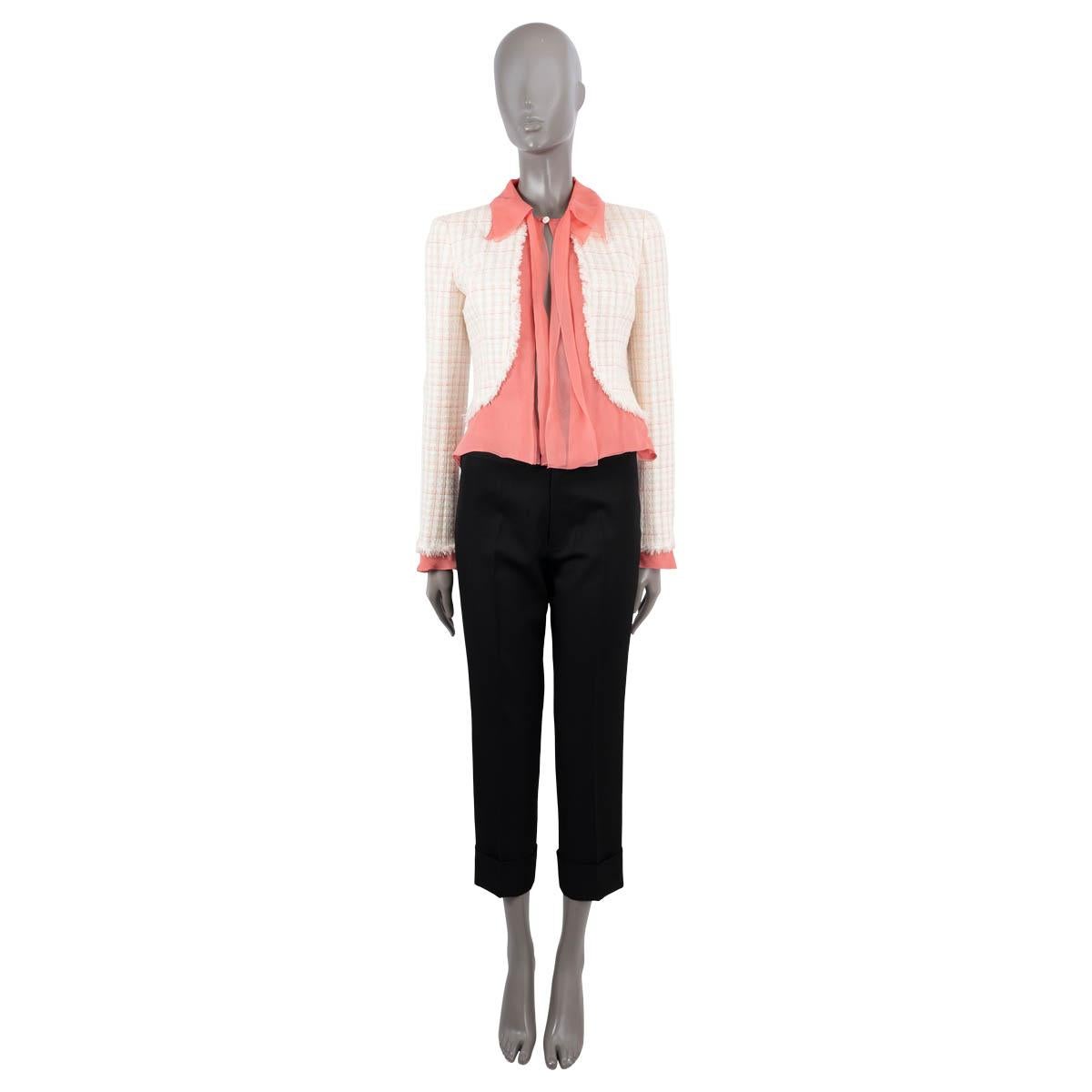 100% authentic Chanel puss-bow tweed jacket in ivory, coral, red and mint green wool (36%), nylon (34%), viscose (16%) and cotton (14%). Features coral silk chiffon panels, collar and cuffs. Closes with one button on the front. Lined in ivory silk