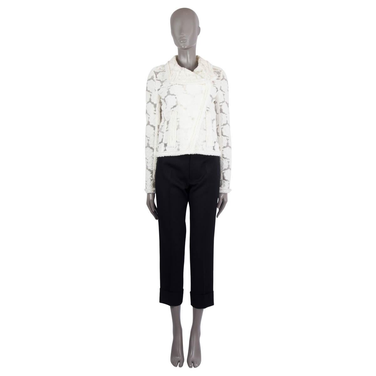 100% authentic Chanel sheer camellia biker jacket in ivory cotton (52%) and nylon (48%). Features epaulettes with enameled buttons, two zipper pockets on the front, fringed trims and clear polyurathene inset on the epaulettes and under the collar.