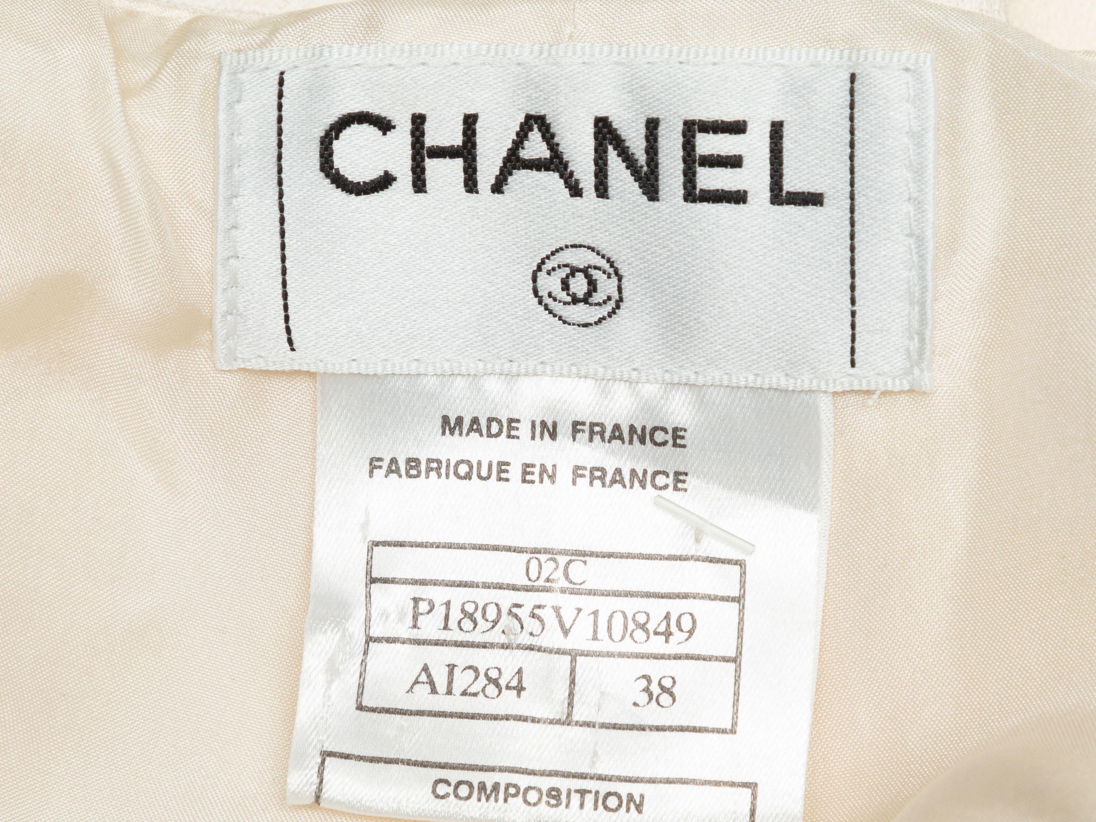Product Details: Vintage ivory straight-leg pants by Chanel. From the Cruise 2002 Collection. Zip closure at side. Designer size 38. 24