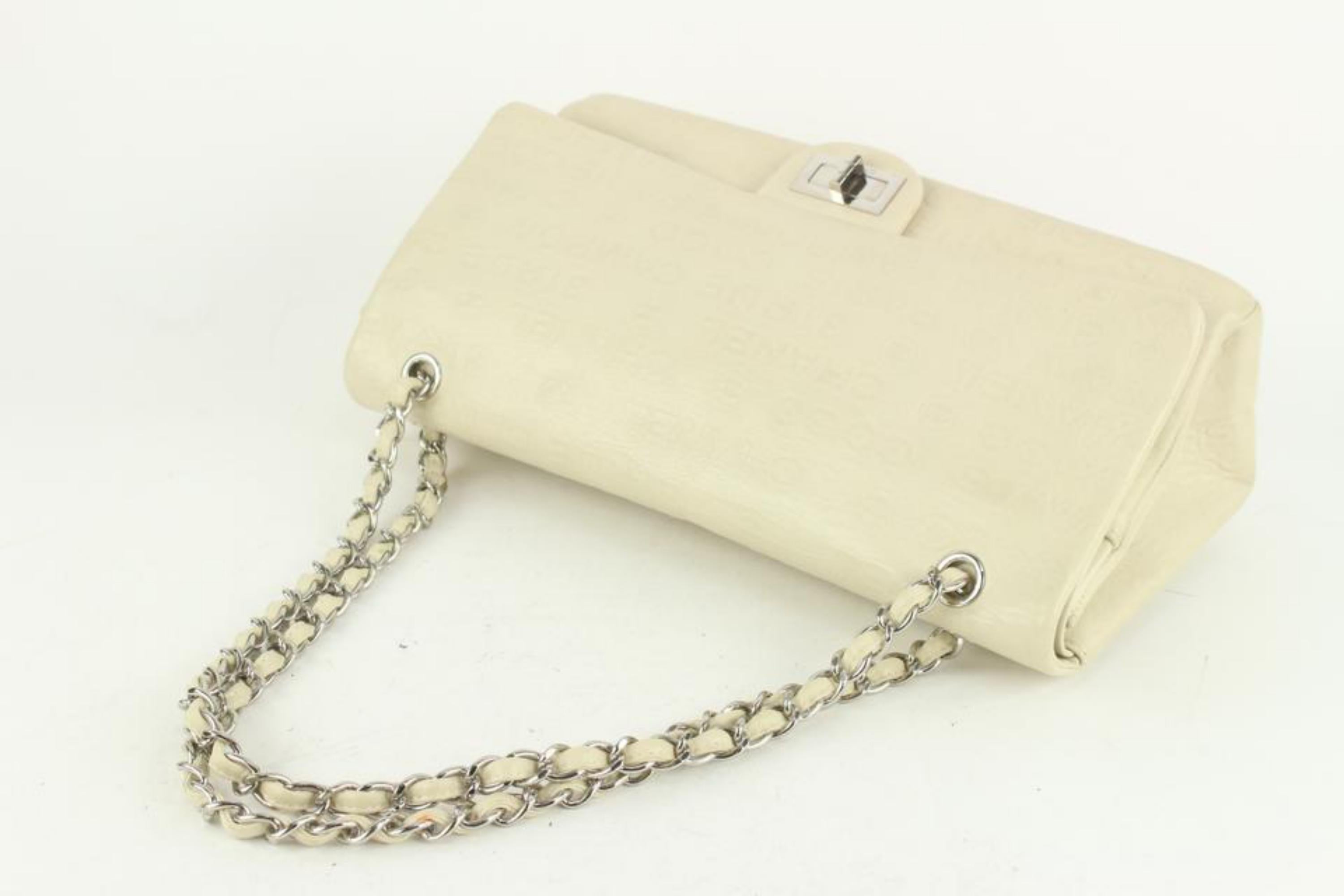 Chanel Ivory Embossed CC Calfskin Maxi Double Flap SHW 2cc1108 For Sale 1