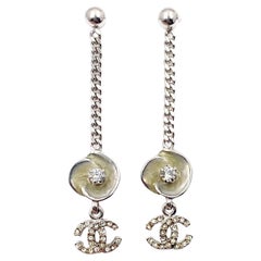 Chanel Ivory Enamel Camellia CC Crystal Chain Dangle Piercing Earrings