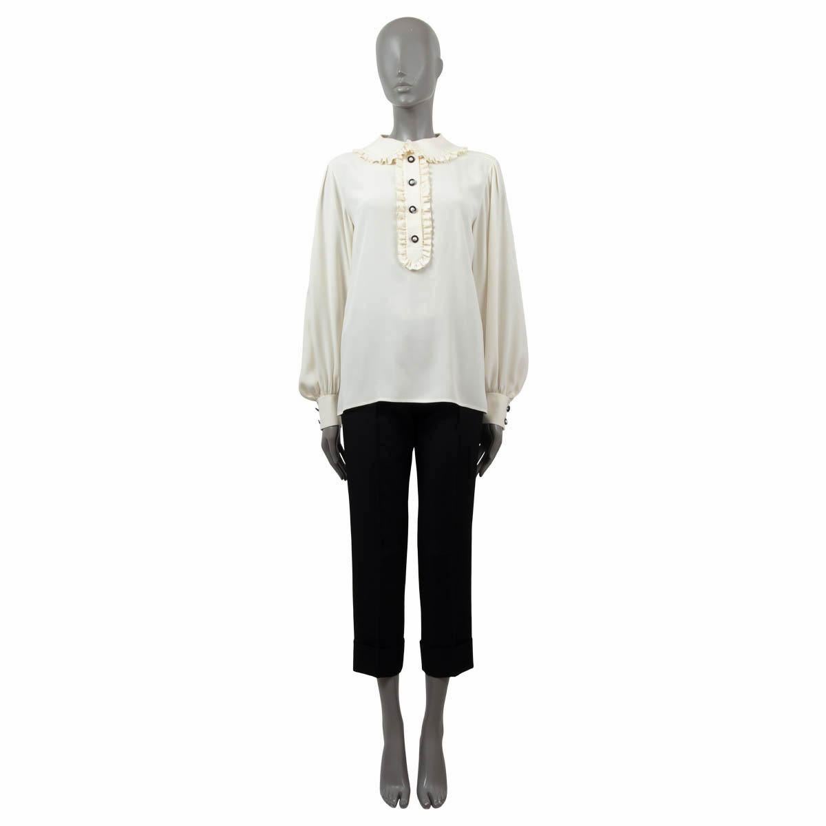 100% authentic Chanel ruffled peter-pan collar blouse in ivory silk (100%). The design features faux peral embellished buttons at front and cuffs. Has been worn and is in excellent condition. 

Measurements
Tag Size	38
Size	S
Shoulder Width	45cm