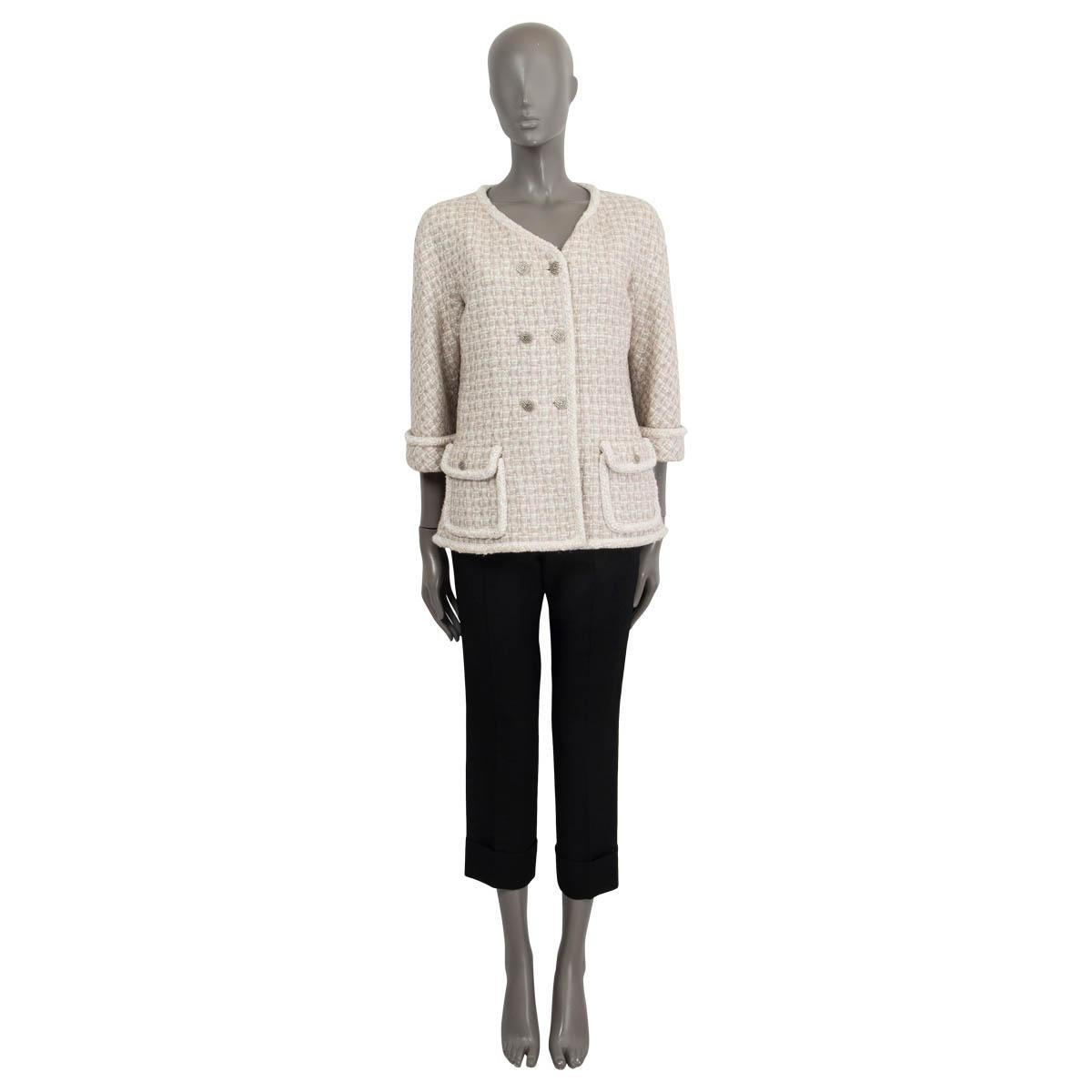 100% authentic Chanel collarless double-breasted tweed jacket in ivory, grey and taupe viscose (45%), cotton (19%), wool (15%), polyurethane (12%) and polyamide (9%). Features braided trim and 3/4 sleeves and flap pockets on the front. Lined in silk