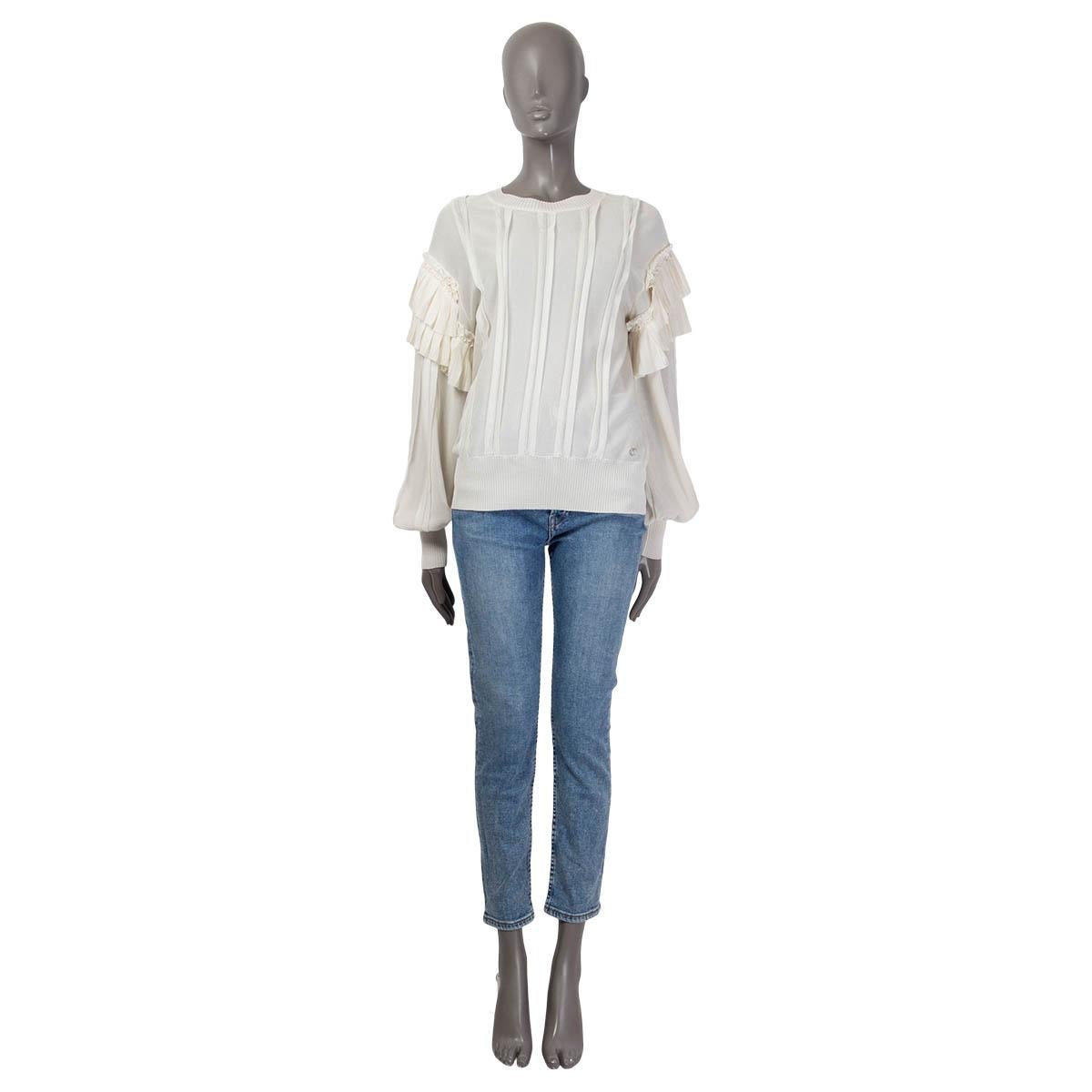 100% authentic Chanel long sleeve sweater in ivory silk (assumed cause tag is missing). 2018 pre spring/summer collection. Features ruched shoulders and a 'CC' emblem on the front. Has a ribbed hemline, collar and ribbed cuffs. Unlined. Has been