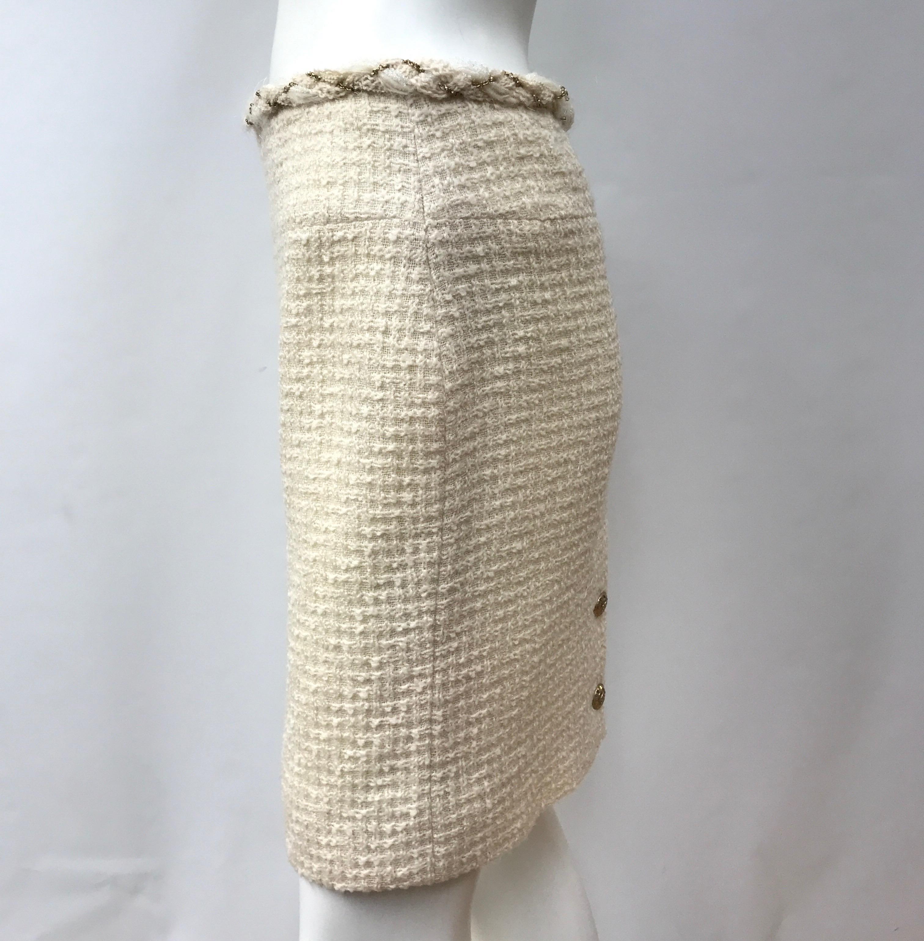 Chanel Ivory Wool Skirt-38. This beautiful Chanel skirt is in excellent condition, it shows minimal sign of use with exception to needing slight shaving. It is made of wool throughout and has a silk lining. The skirt is ivory and has a braided