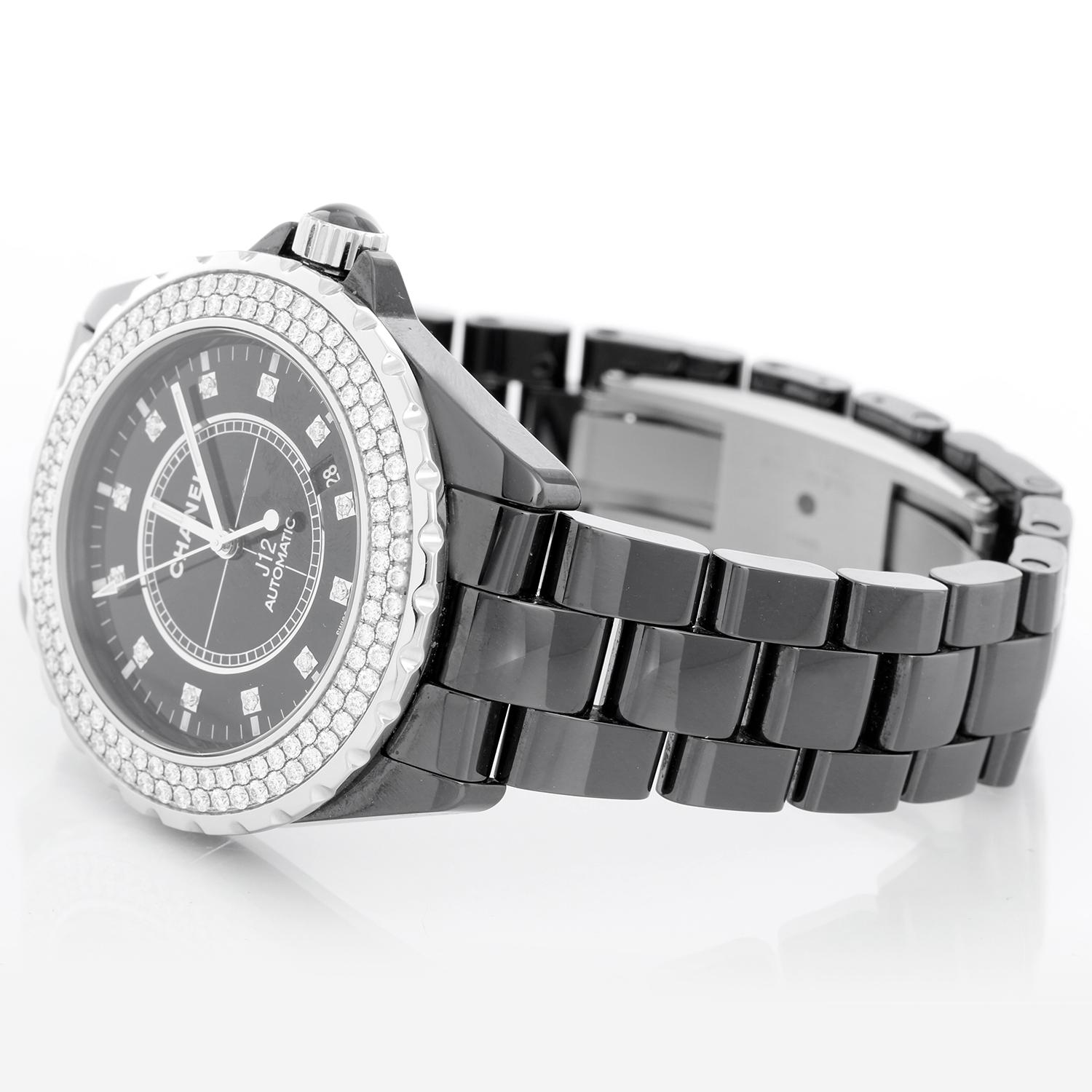 Chanel J12 Black Ceramic Automatic Large Unisex Watch - Automatic. Black ceramic case with steel rimmed unidirectional rotating bezel and steel crown with. Two rows of diamond bezel (43mm diameter). Black dial with pave diamond center and diamond