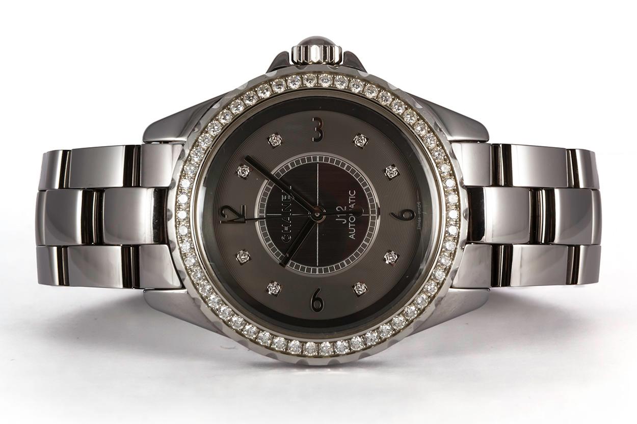 We are pleased to offer this Authentic Chanel J12 Chromatic Ceramic Watch H2566. This watch features a8mm titanium ceramic case, diamond bezel, titanium dial with 8 diamond hour markers, automatic winding movement, and a titanium ceramic bracelet.