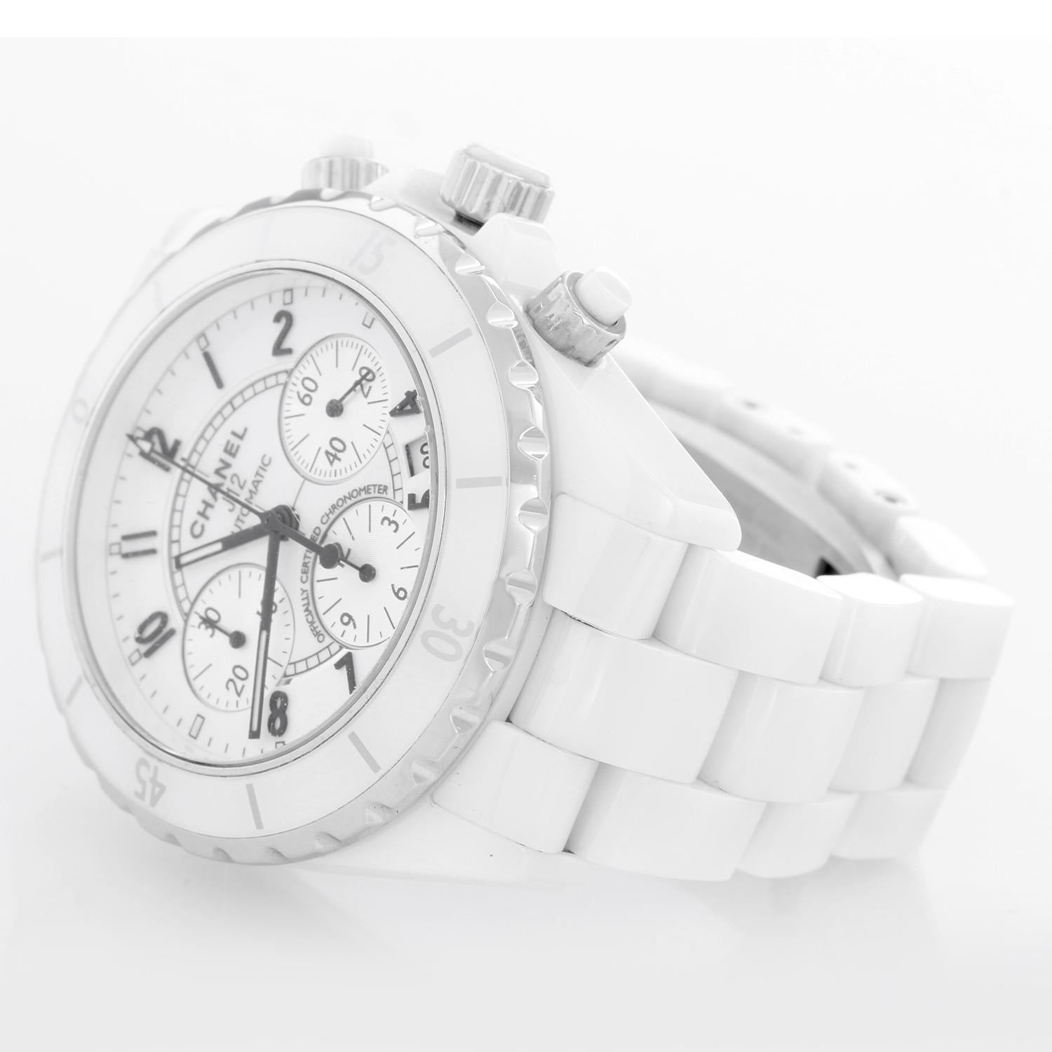 Chanel J12 White Ceramic 41mm Chronograph Watch H1007 - Automatic winding. White ceramic case (41mm diameter). White dial with Arabic numerals; hour, minute and seconds recorders; date between 4 and 5 o'clock. White ceramic J12 bracelet. Pre-owned