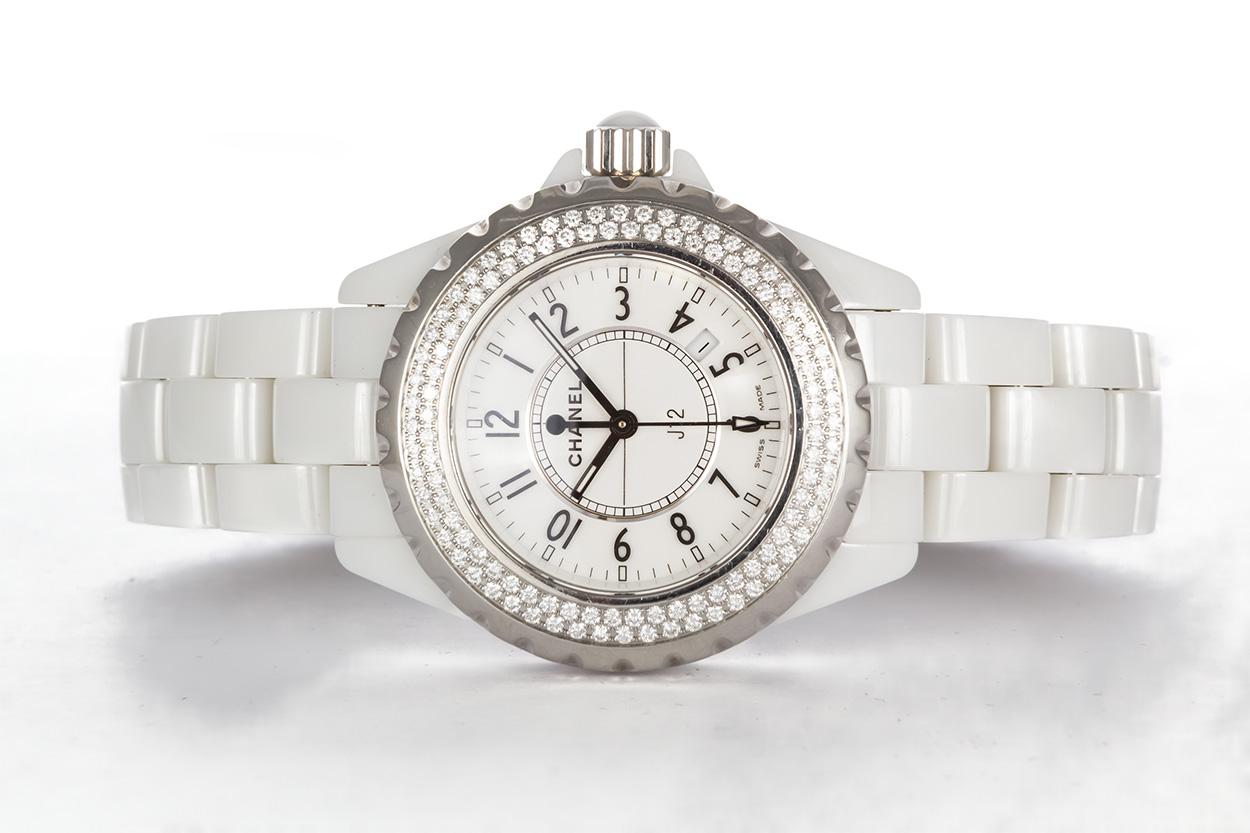 We are pleased to offer this Authentic 2007 Chanel J12 White Ceramic Diamond Bezel Ladies Watch H0967. This watch features a 33mm white ceramic case with a factory original diamond bezel and white dial. It has a quartz movement so it will always be