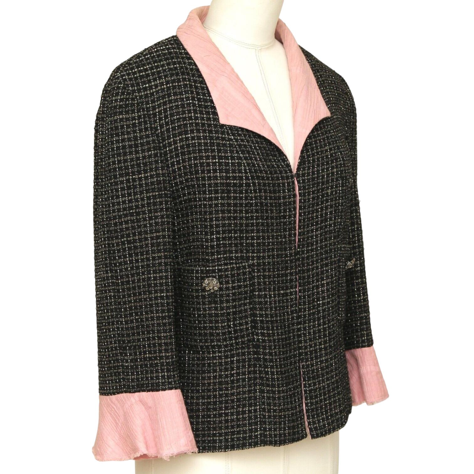 GUARANTEED AUTHENTIC CHANEL 2012 COLLECTION IRIDESCENT BLACK TWEED JACKET

Matching Skirt Available For Sale In A Separate Listing.

Design:
- Black iridescent tweed jacket from the 2012 collection.
- Pink collar, cuffs and lining.
- 3/4 sleeve.
-
