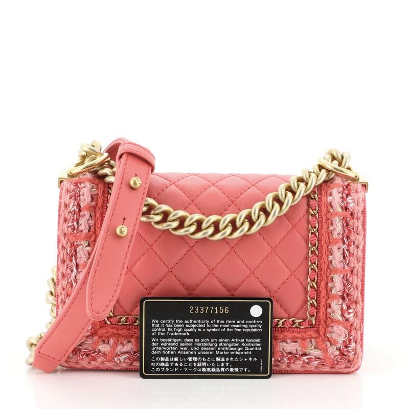 This Chanel Jacket Boy Flap Bag Quilted Lambskin with Tweed Small, crafted from pink quilted lambskin and tweed, features chain link strap with leather pad, woven-in leather and tweed chain trim and matte gold-tone hardware. Its Boy push-lock
