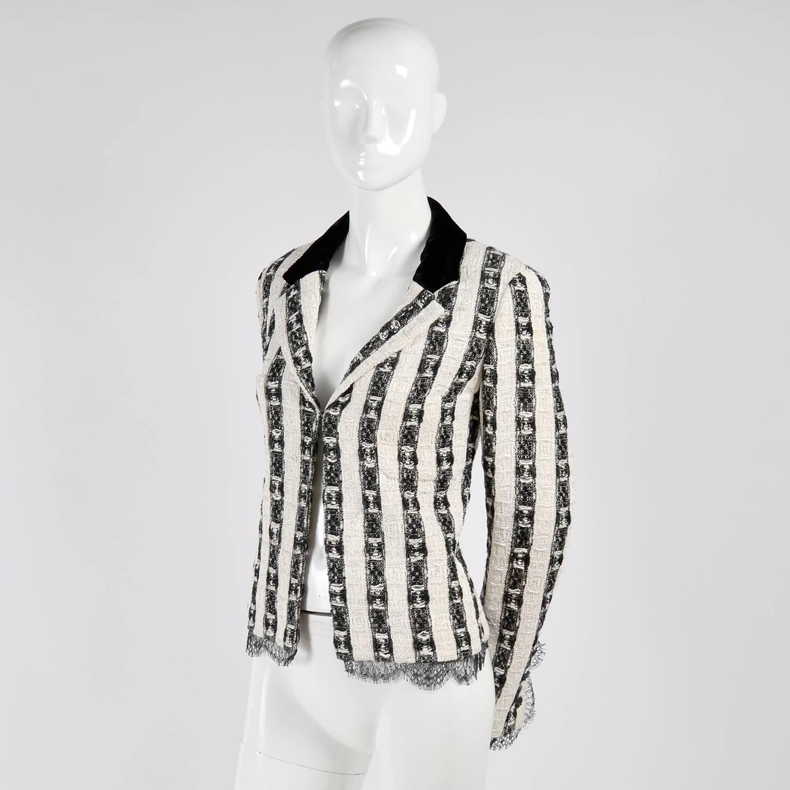 This is a beautiful black and white Lesage tweed blazer from the Chanel Autumn/Winter 2004 collection. This gorgeous vintage Chanel jacket has black and white textured stripes of woven nylon, cotton, rayon, wool, linen and acetate. It has black