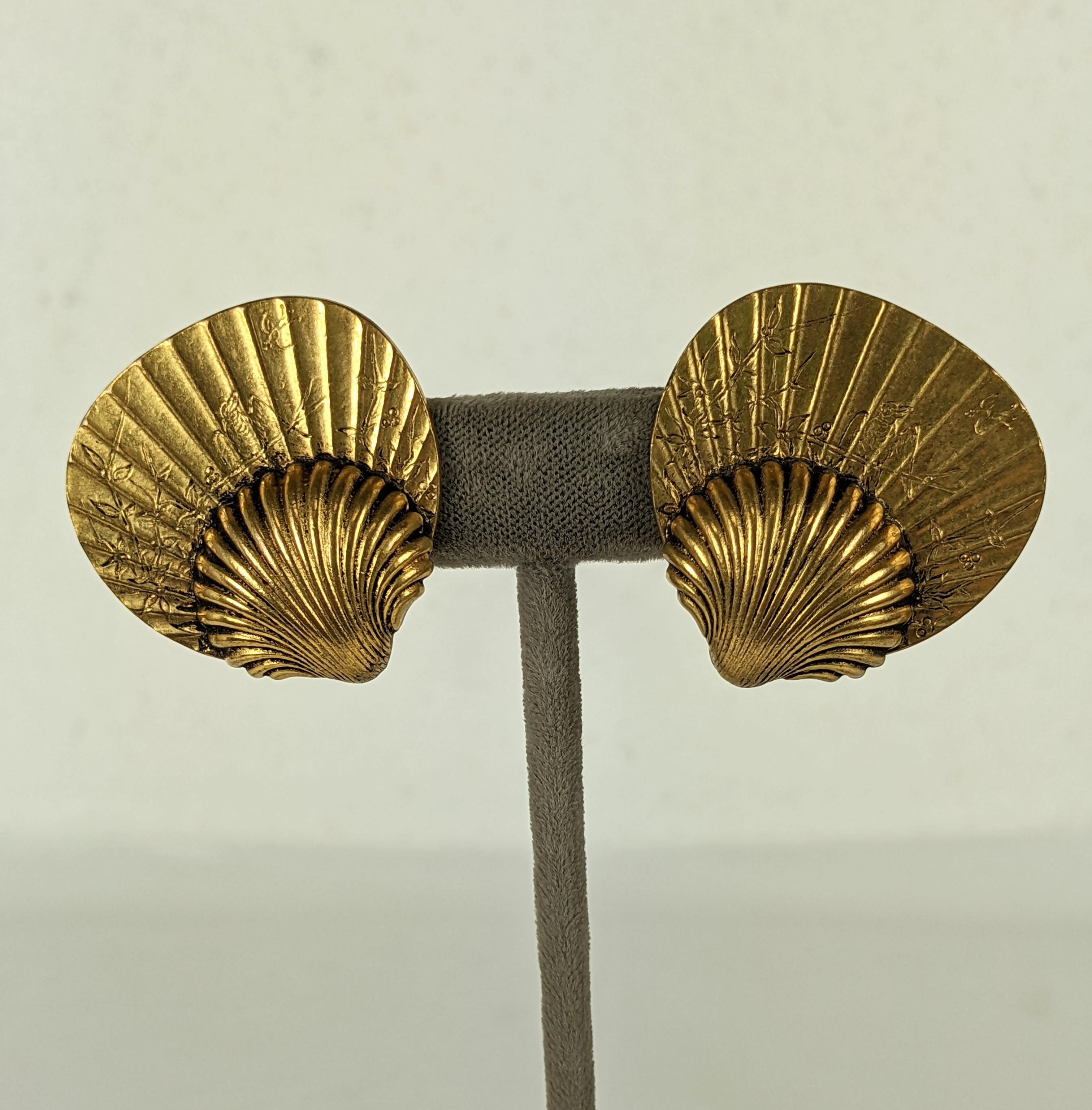 Lovely Chanel Japonesque Fan Earrings circa 1960's France. A marriage of European and Eastern aesthetics with a bird engraved Japanese fan motif mounted with a classical French clam shell motif in Antique gold finish by Maison Denez. Clip back