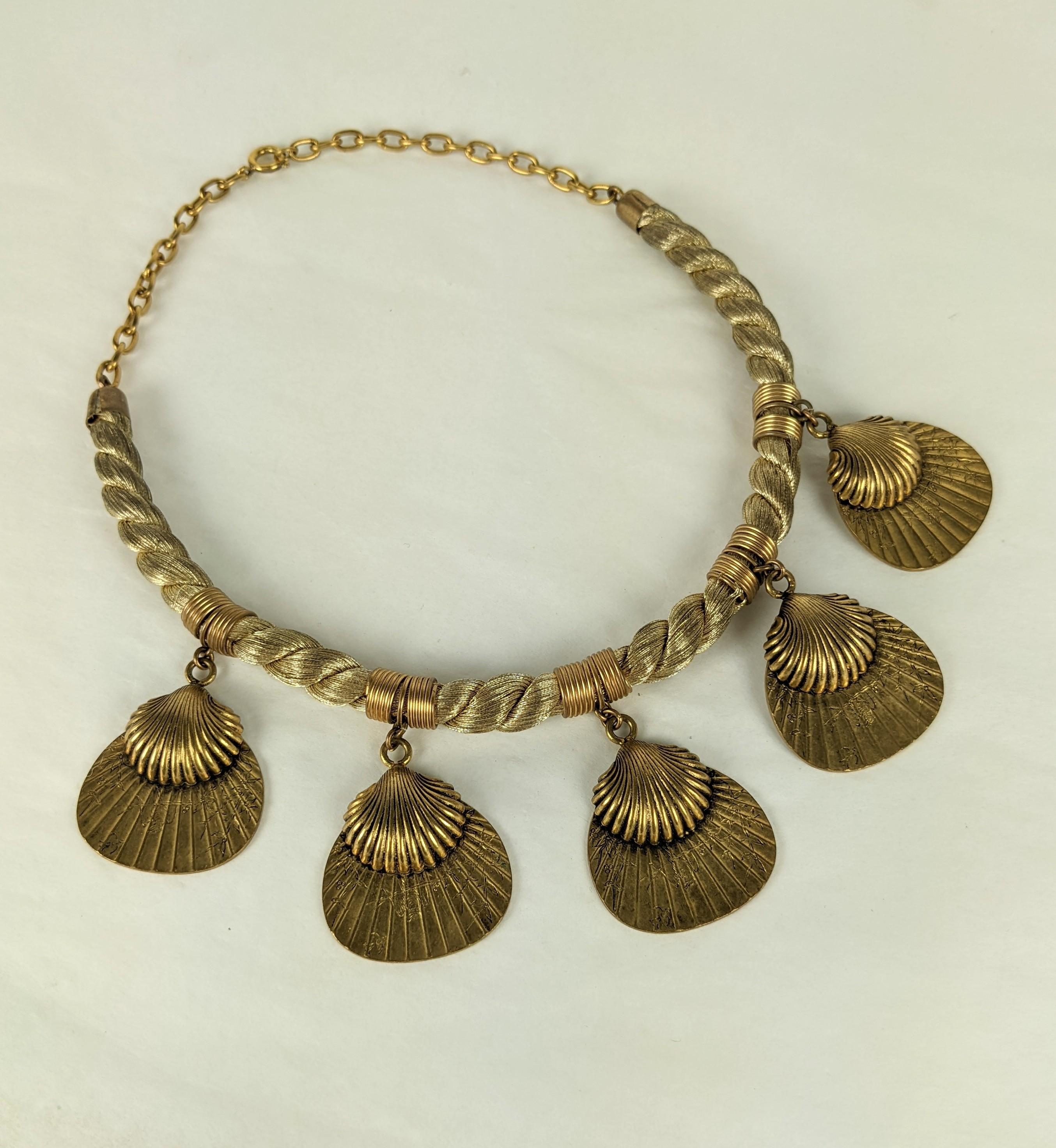 Chanel Japonesque Fan Pendant drop necklace circa 1960's France. A combination of European and Eastern aesthetics with bird engraved Japanese fans mounted with a classical french clam shell motifs in Antique gold finish as pendants on a twisted lame