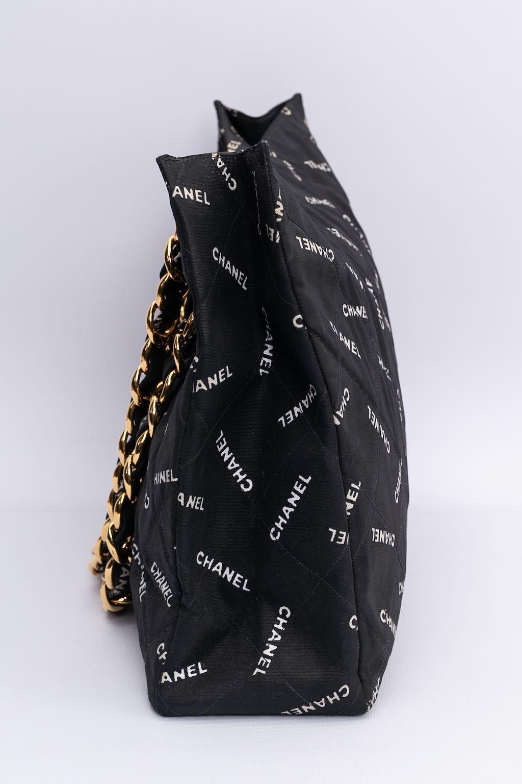 Chanel (Made in France)- Tote bag in black jersey printed with 