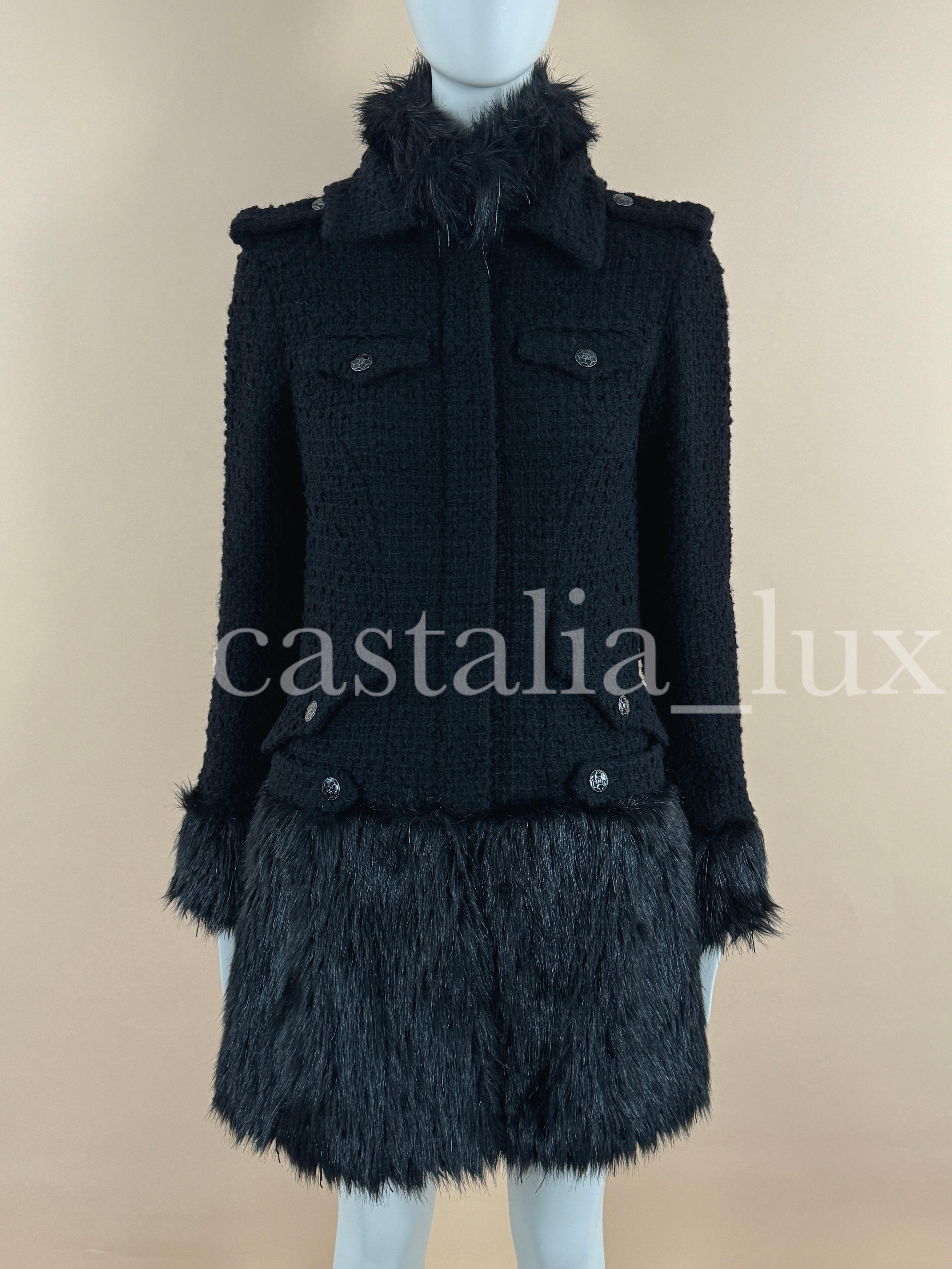 Stunning Chanel black tweed coat with fantasy faux fur details -- from ARCTIC ICE Collection by Karl Lagerfeld.
- CC logo jewel buttons, logo zip front closure
- hand-crafted black bead accents throughout the fur parts
- full silk lining
SIse mark