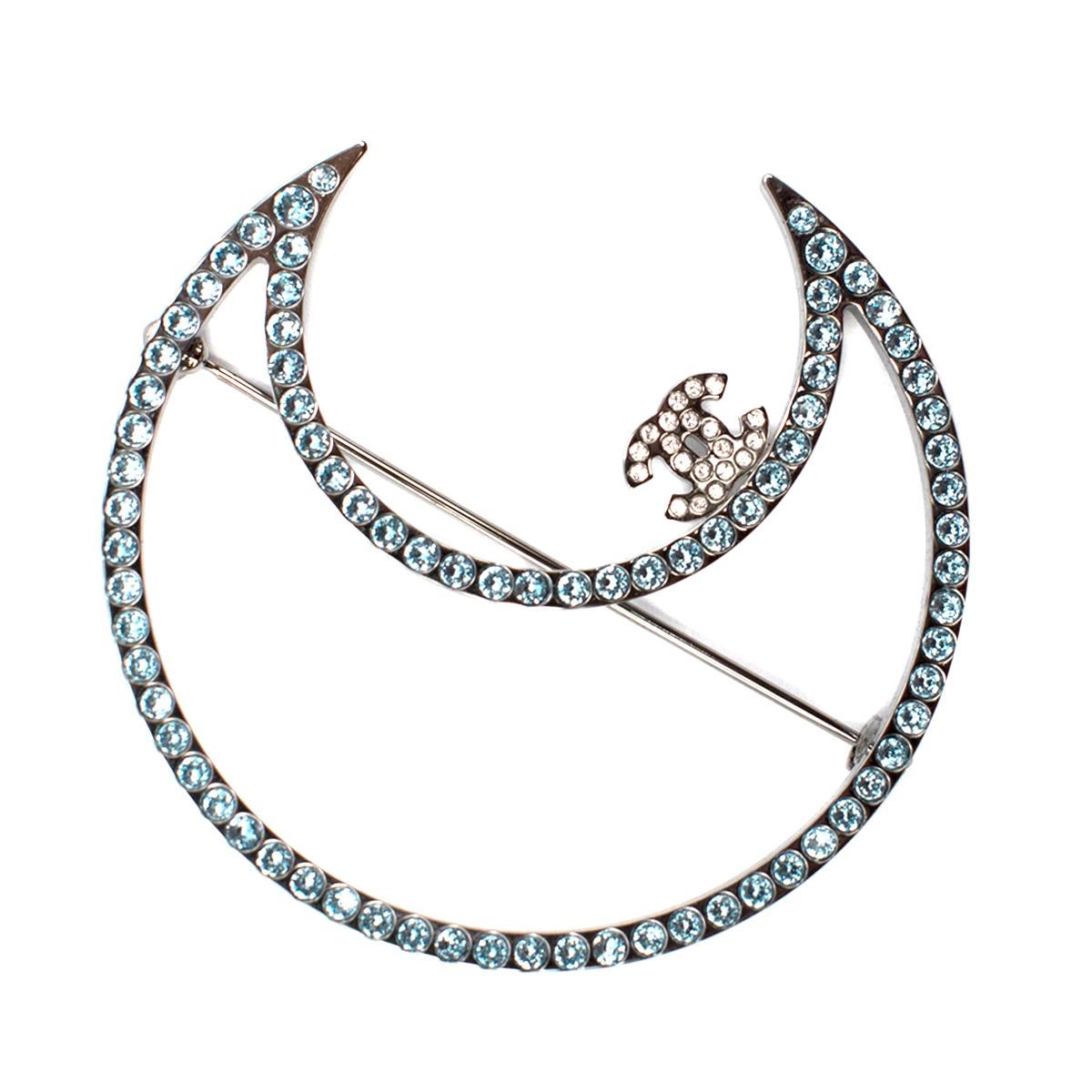 Chanel Jewelled Ruthenium Crescent Moon Brooch

- Moon brooch embellished with blue crystals and brand logo 
- Discrete embossed Chanel G17 K hallmark 
- Safety catch pin with fastening 
- Lightweight 

Please note, these items are pre-owned and may