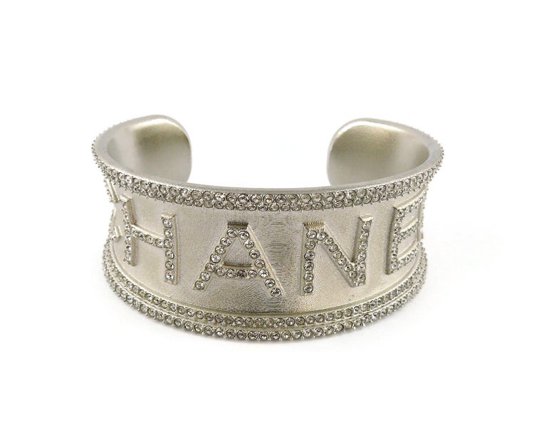 Chanel Jewelled Silver Toned Script Monogram Cuff Bracelet at