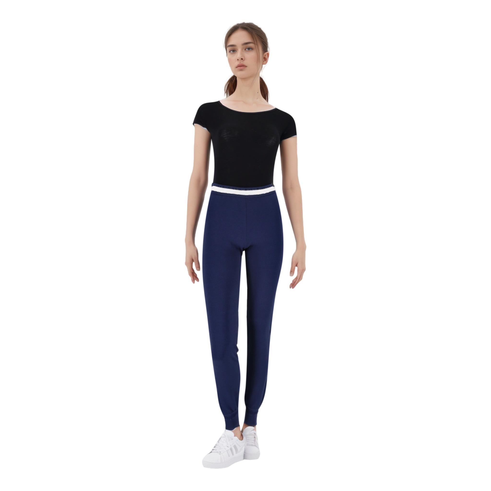Chanel Joggers With 'CC' Logo Stitching

Navy slim-fit high waisted trousers crafted in viscose and detailed with 'CC' logo stitching to the sides.

Featuring white trimmed waist band and ribbed cuffs.

Size – 42IT

Condition –