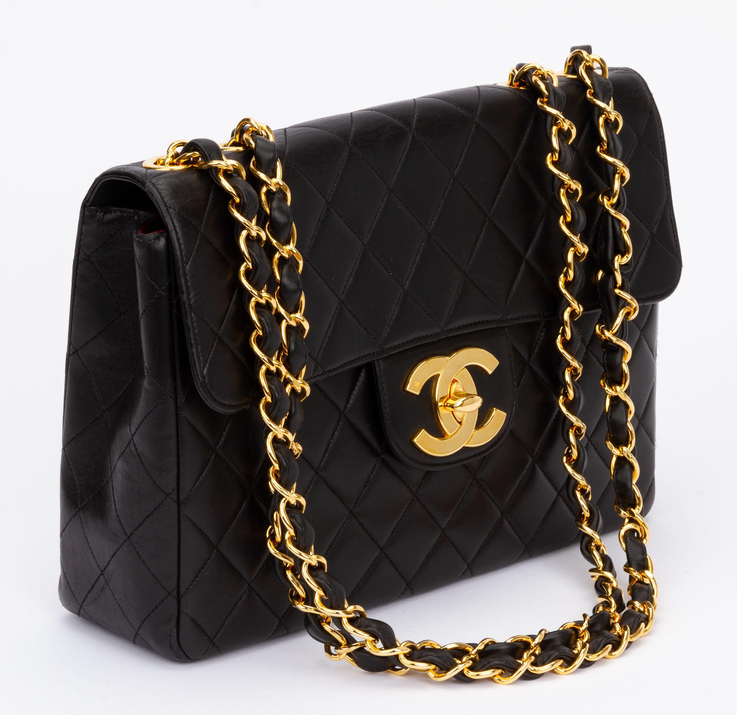 Chanel 90s jumbo black lambskin flap with 24kt gold plated hardware. Excellent condition. Shoulder drop 13