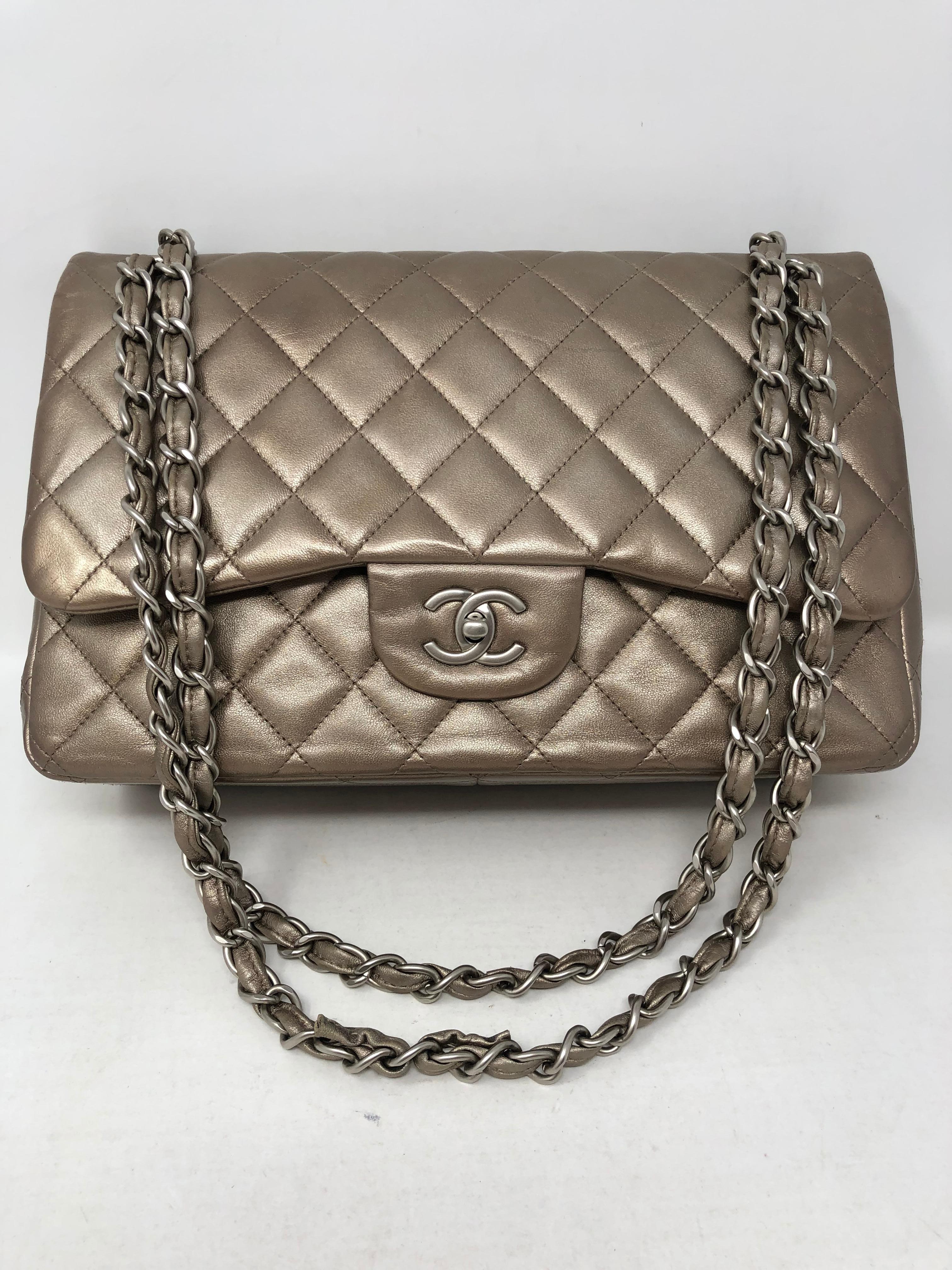 Chanel Jumbo Bronze Metallic in lambskin leather. Beautiful neutral color for all seasons. Silvertone with bronze color. Silver hardware. Good condition. Bag can be worn doubled or as a crossbody. Guaranteed authentic. 