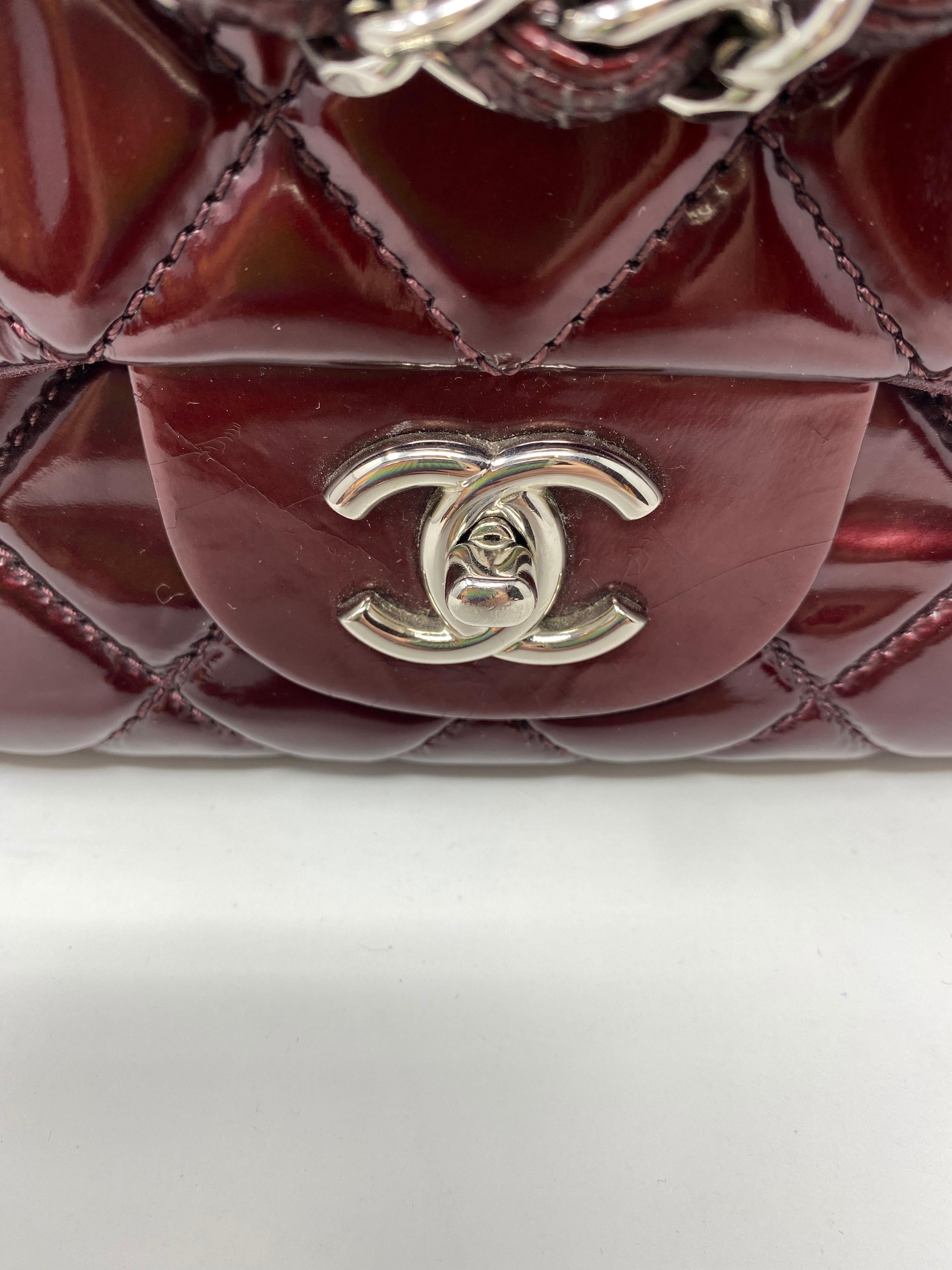 Chanel Burgundy Patent Leather Jumbo Bag. Good condition Chanel bag with silver hardware. Inside clean. Light wear. Please view all photos. Marks inside from impression of the leather. Guaranteed authentic. 